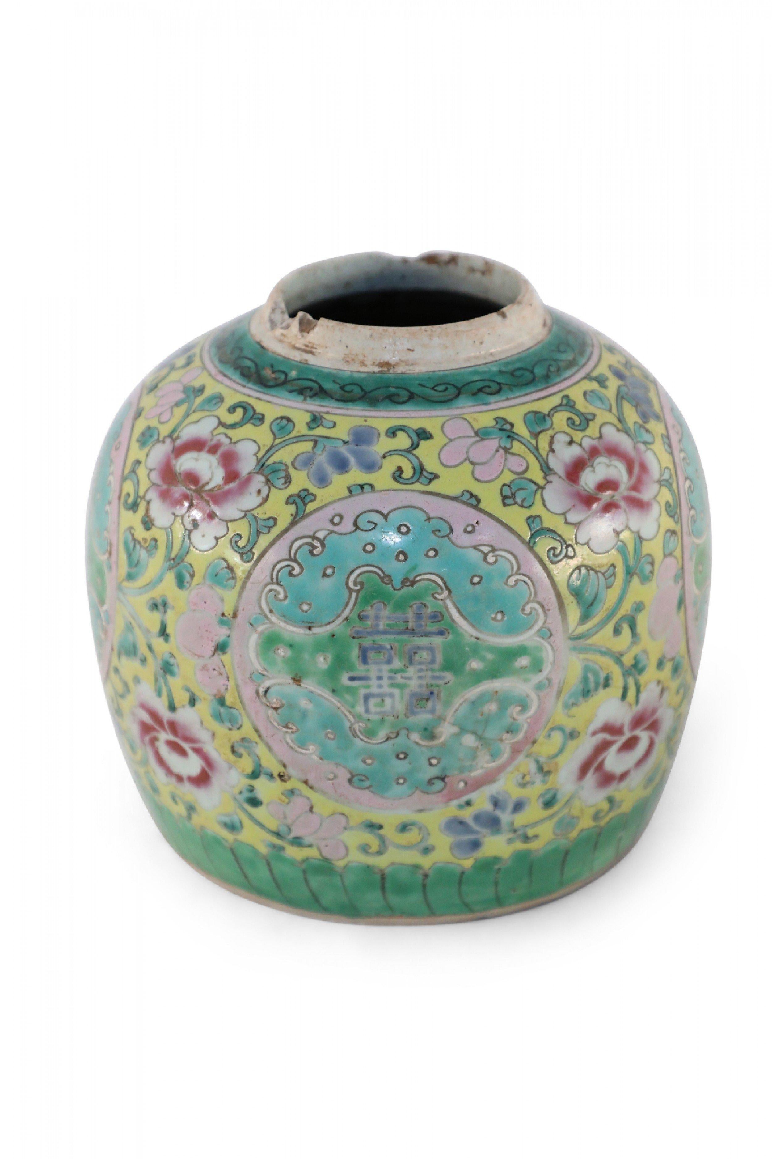 Antique Chinese (Early 20th Century) low, rounded porcelain vase, known as a watermelon jar, incised and painted with green vines holding pink flowers on a yellow background, surrounding central pink and blue medallions with characters, and green