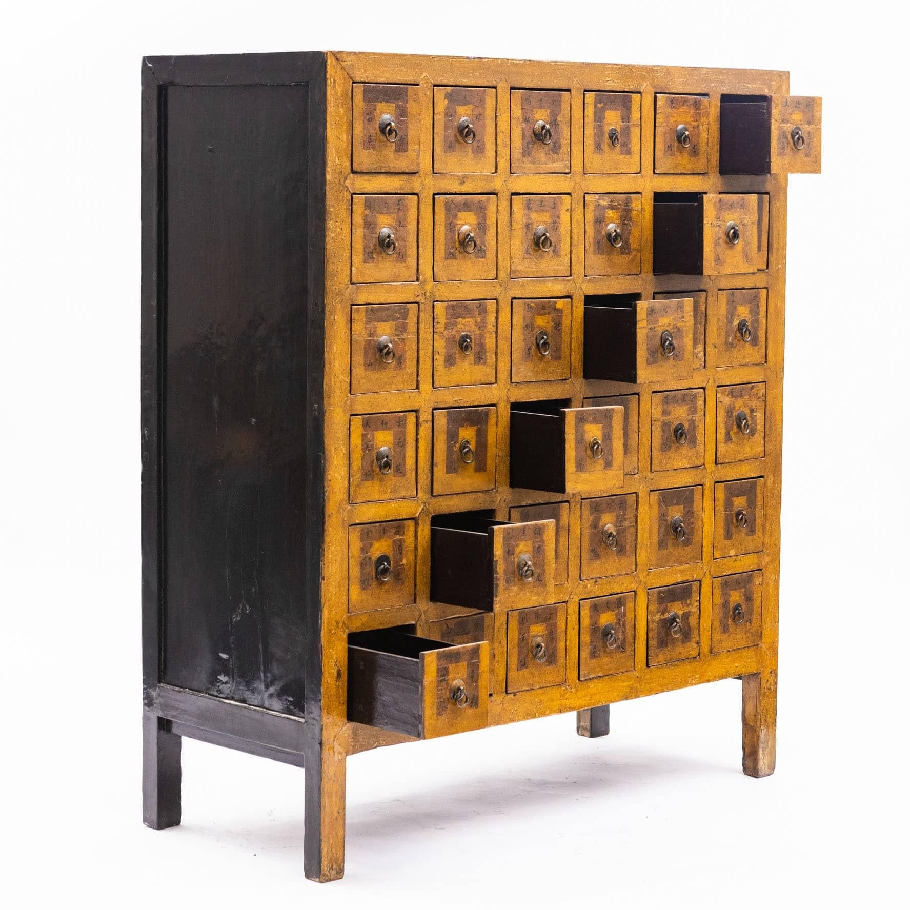 Apothecary (Pharmacy Medicine) Chest in original lacquer.
36 drawers (15 x 15) with description of contents, natural medicine, minerals, etc.
Linden wood in a curry color & black lacquer 
Shanxi Province approx. 1860.

Drawers Inside measure :
H 10