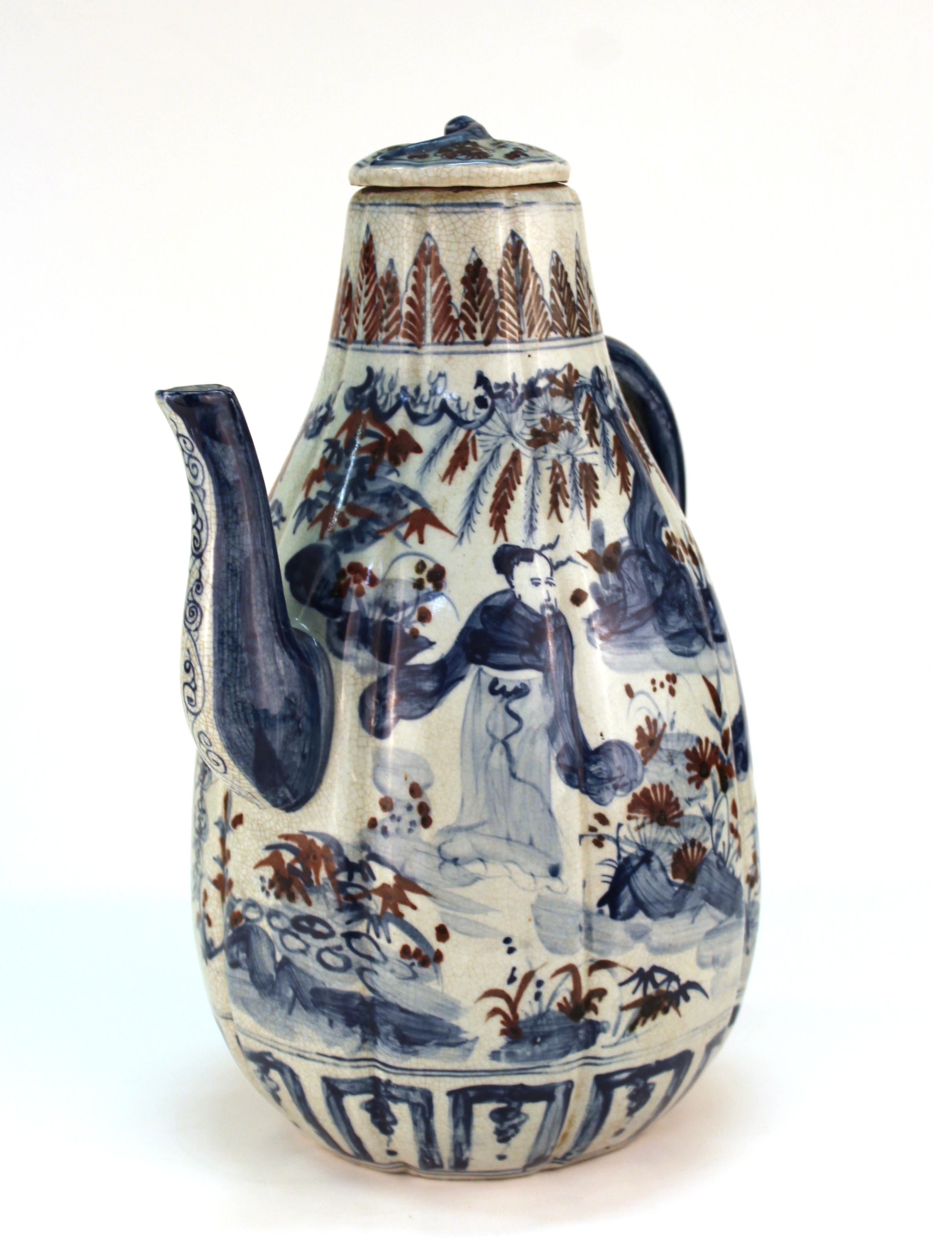 Chinese Yuan Dynasty style marked large under-glazed blue and iron oxide red porcelain lidded wine ewer with ribbed sides in an elaborate all-over design of scholars in a garden setting between borders of stiff fans and feathers. A character