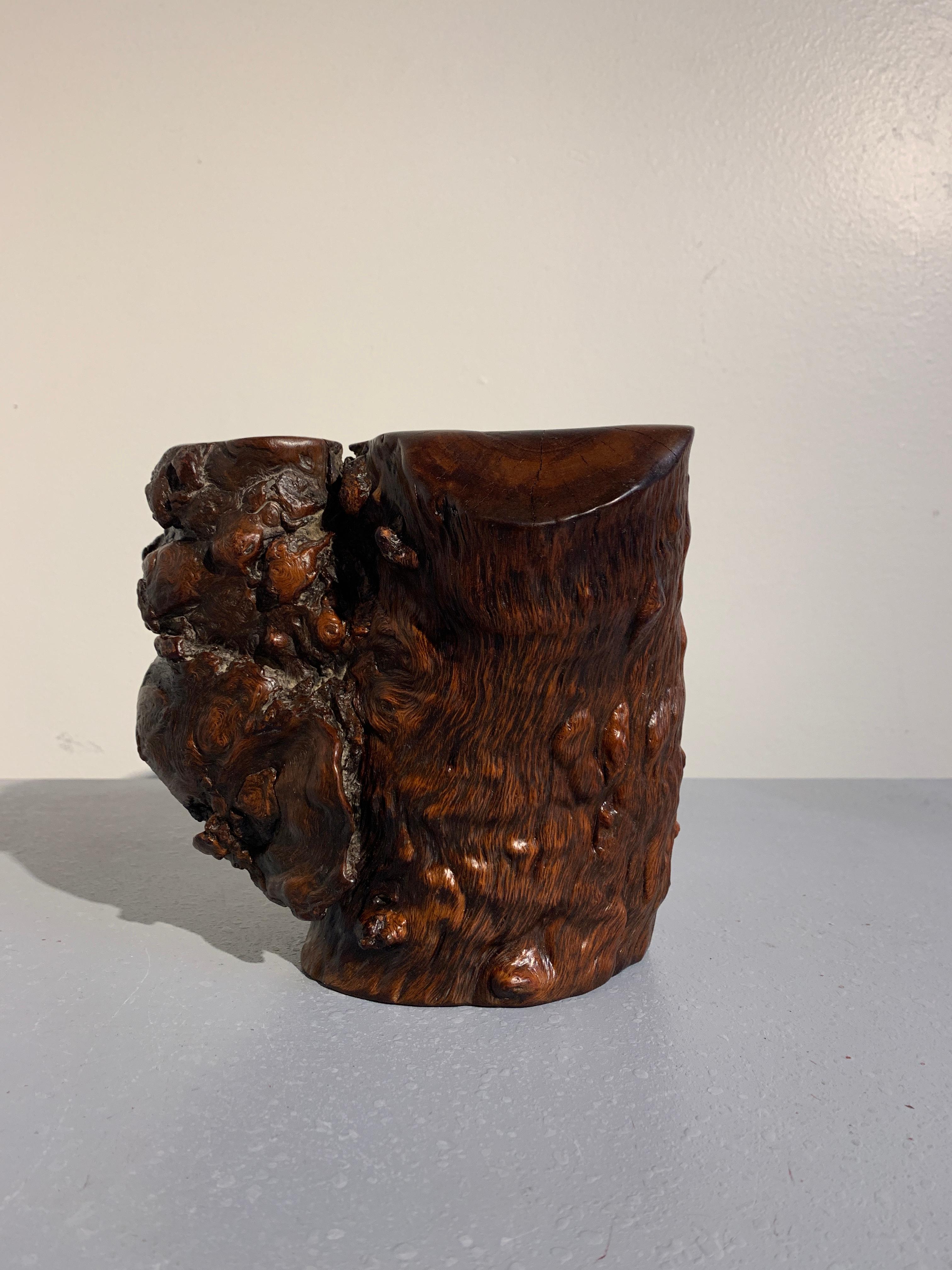 A stunningly figured and beautifully grained Chinese Republic period burled zhazhen hardwood brushpot.

The burl wood brush pot, made of precious zhazhen (mulberry) wood, has been taken from he natural trunk of the tree. Of libation cup form, the