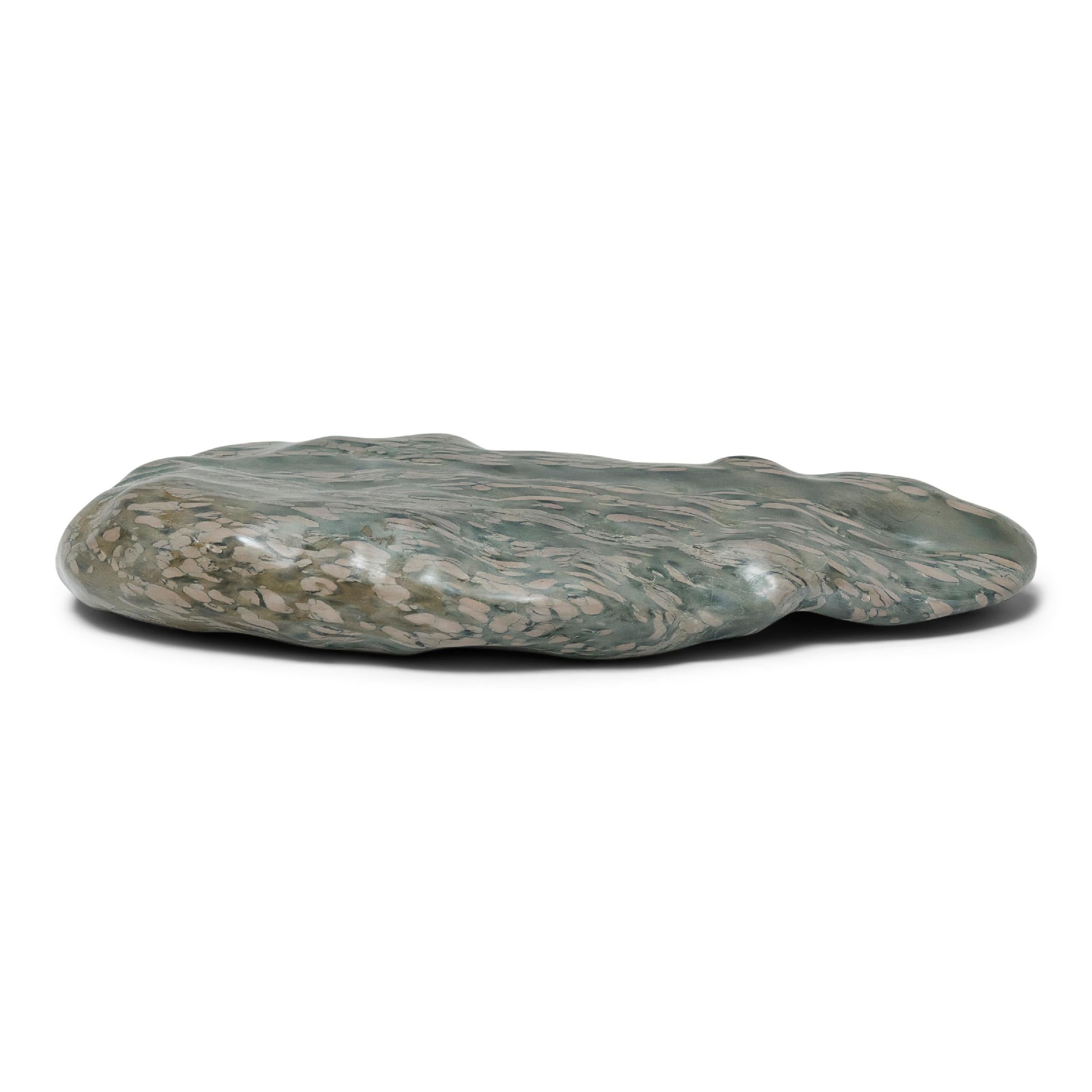 A well-chosen stone is the focal point of both a traditional Chinese garden and a scholar's studio - evoking the complexities of nature and inspiring creative thought. This sculptural zhenzhu stone, also known as pearl stone or puddingstone, is a