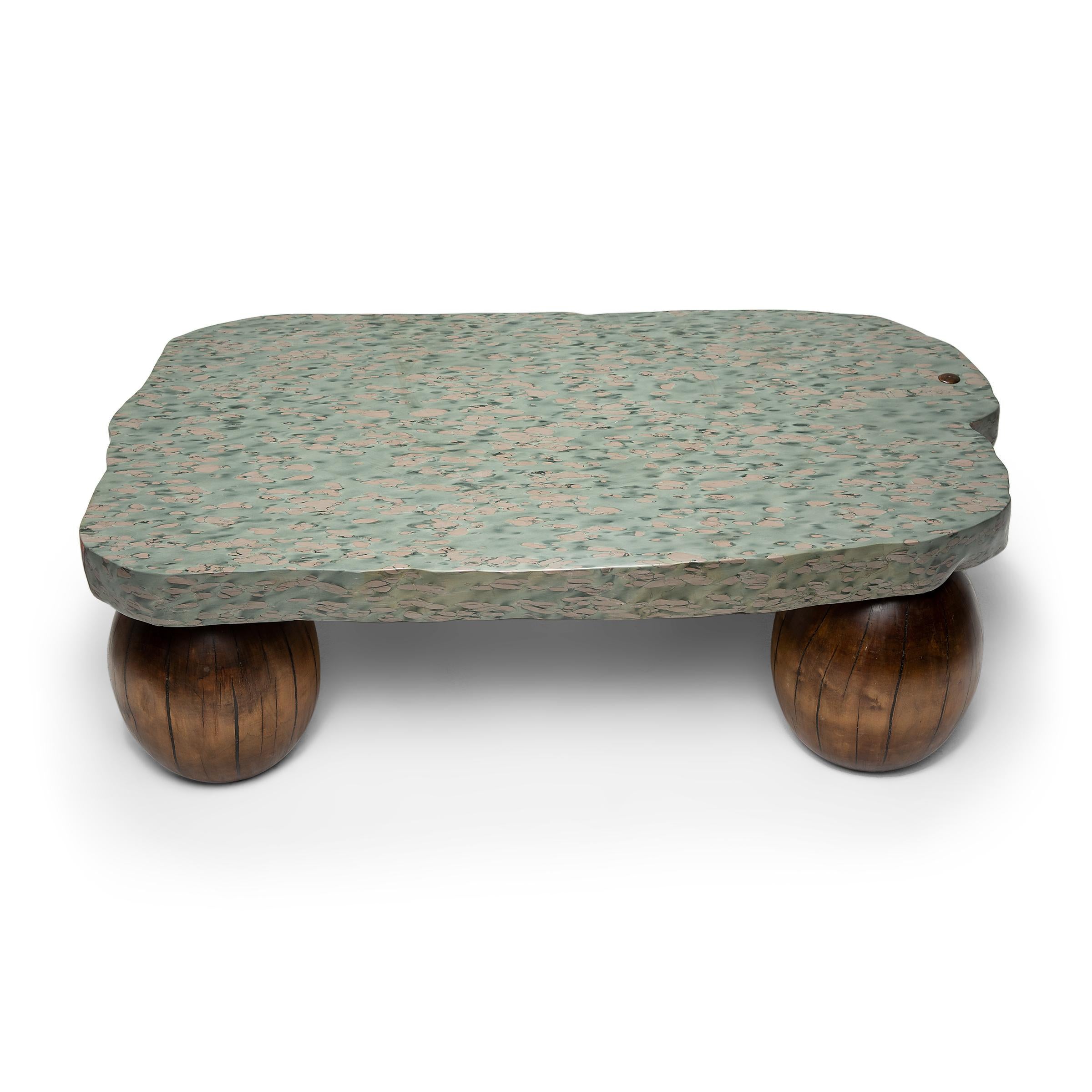 This one-of-a-kind coffee table is topped with an expansive stone slab formed of zhenzhu stone, a conglomerate limestone extracted from Lake Tai in Jiangsu province. Speckled with almost painterly daubs of color, the sought-after stone has been