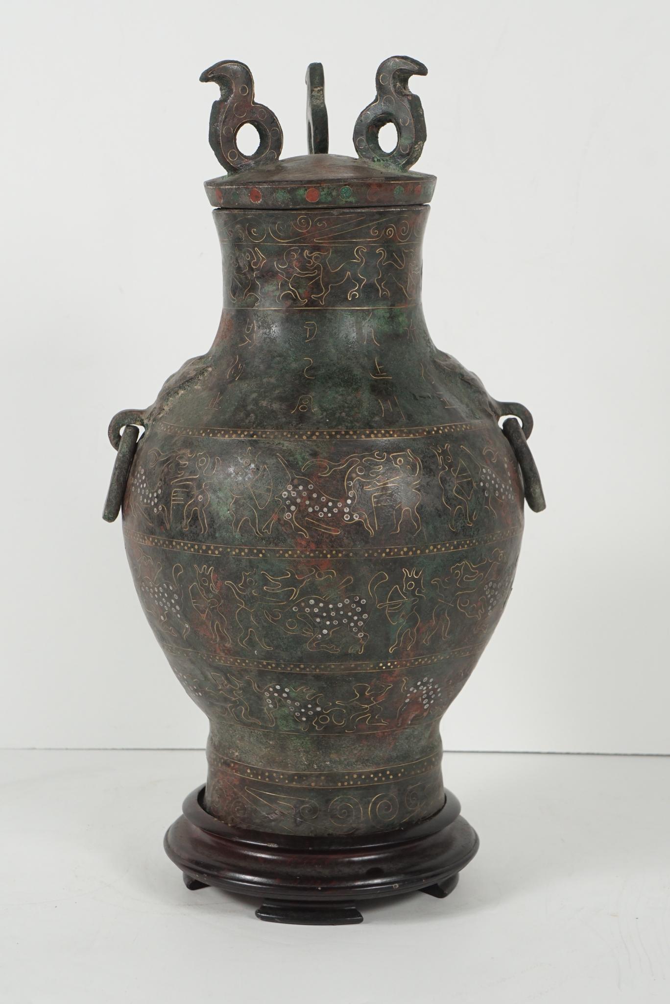 This cast bronze vessel was made in China as an honorific presentation circa 1920. Cast in the style of the Zhou dynasty it would have been used ritually as a wine container and placed in tombs as an offering. The Chinese have for centuries created