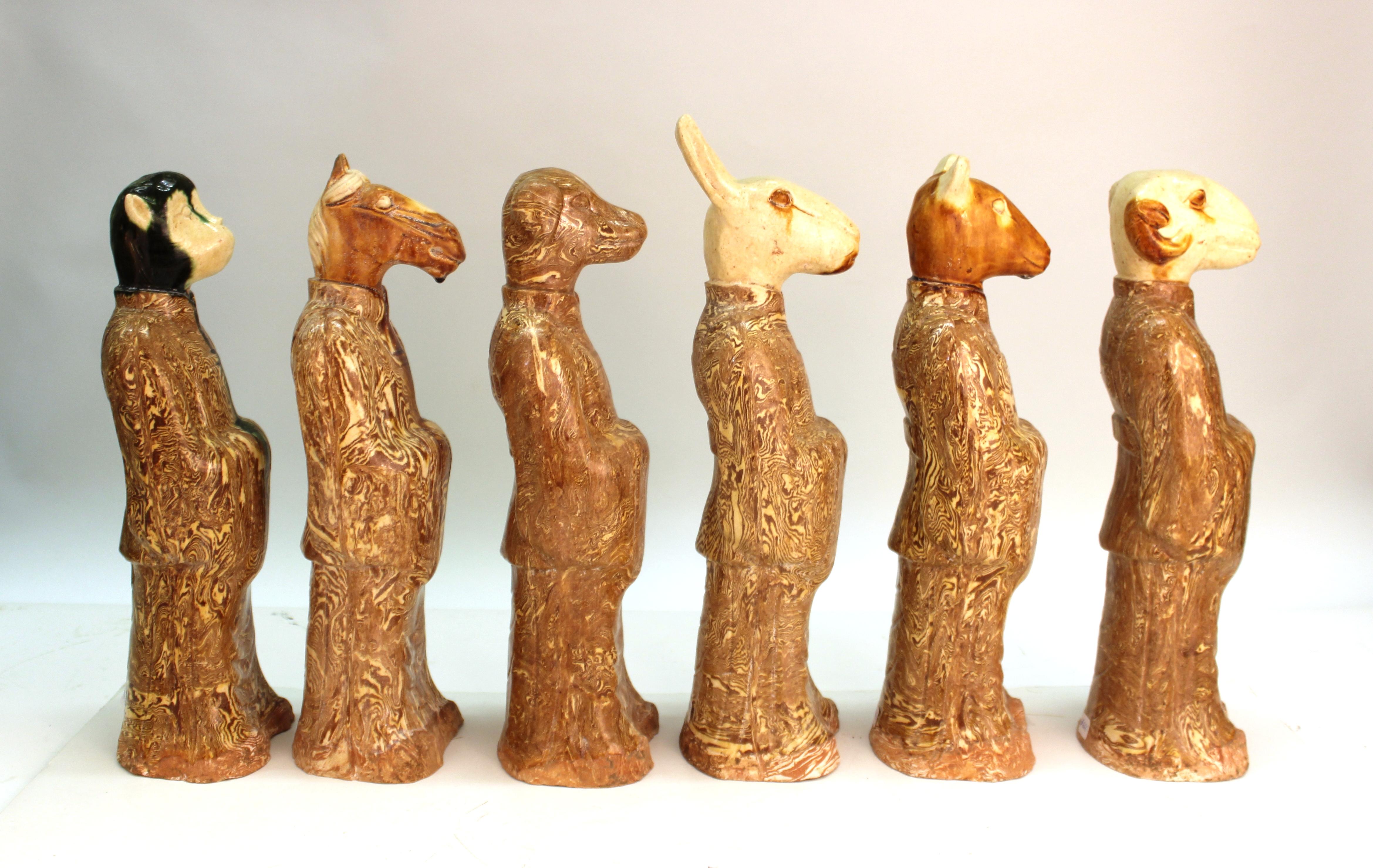 Chinese set of six zodiac figures sculpted in clay, with a glaze. The set was made in China in circa 1930 and is in great vintage condition, with some age-appropriate wear to the bases and some minor fading of the glaze.