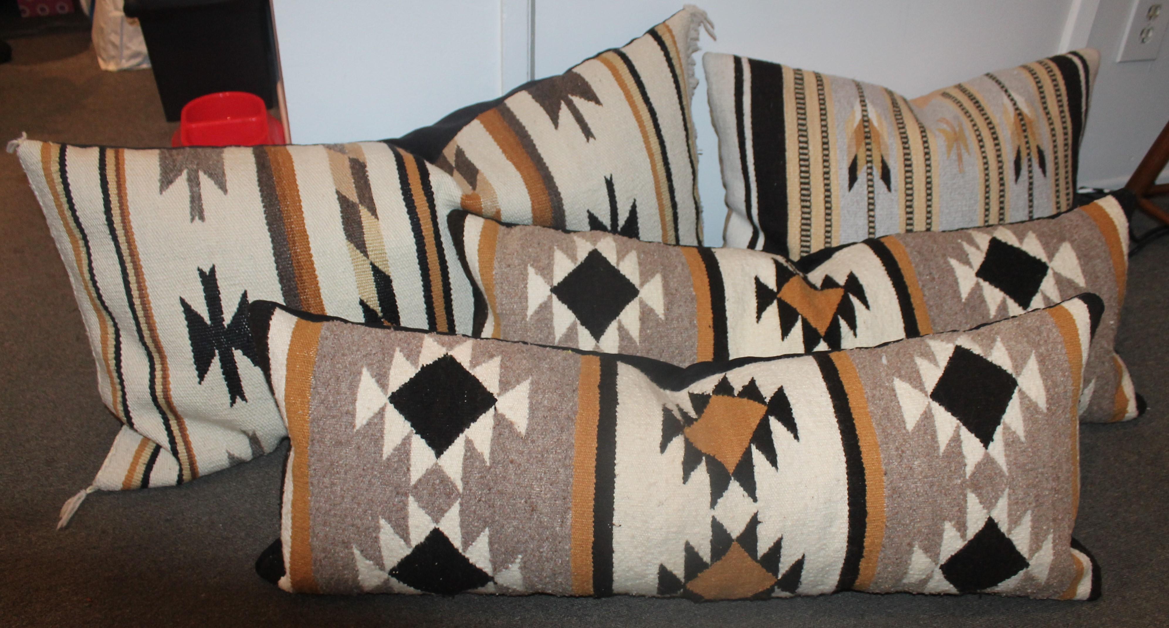 This collection of four Navajo Indian weaving pillows are in fine condition. All look so great together and we wanted to offer a great price on the collection.

Pair of Chinle each measure 13 x 38

larger Chinle measures - 37 x 19
Mid sized