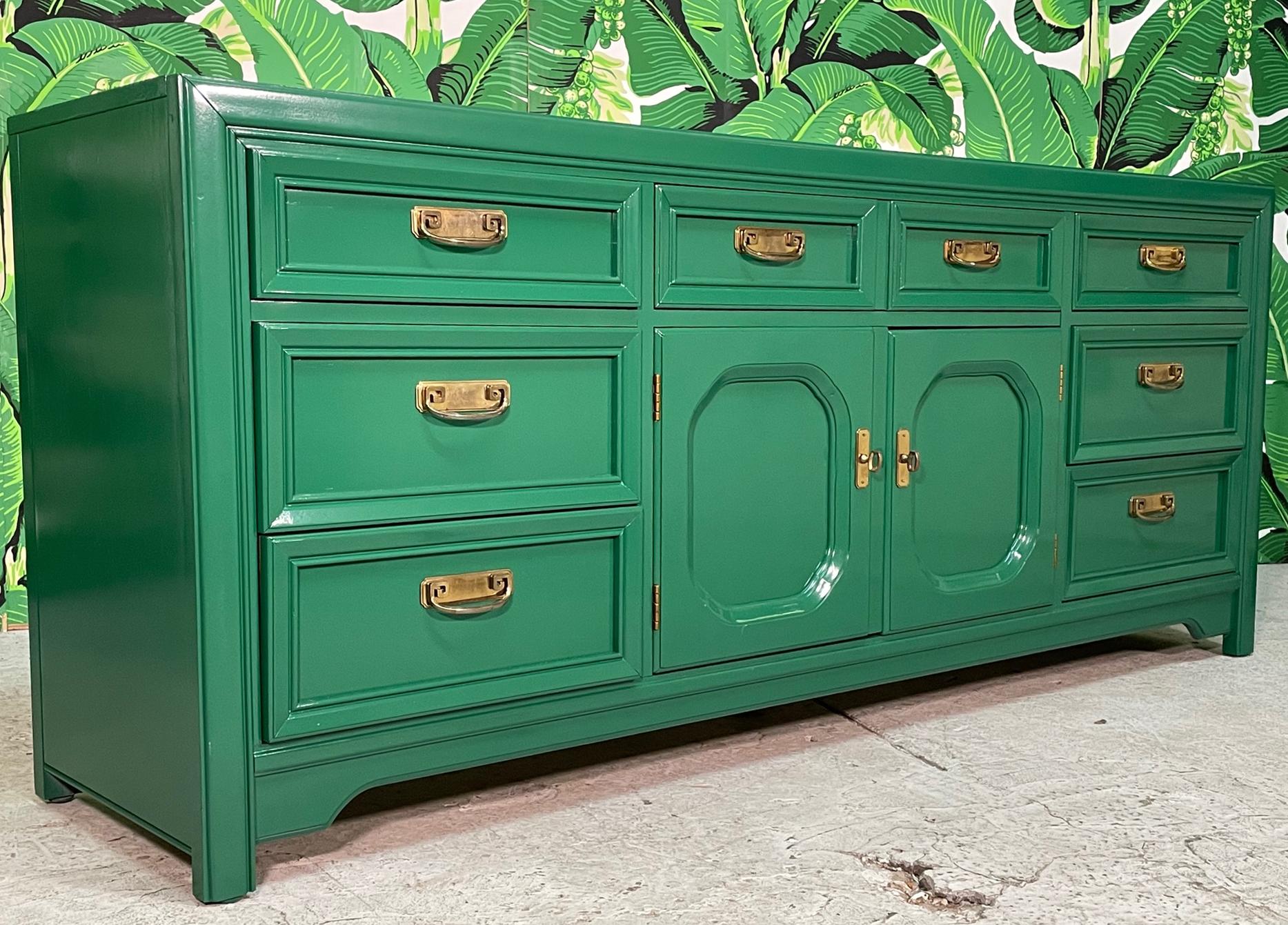 Triple dresser by Thomasville features a fresh glossy lacquered finish and brass hardware in greek key form. Good condition with minor imperfections to the newly lacquered finish.
For a shipping quote to your exact zip code, please message us.

