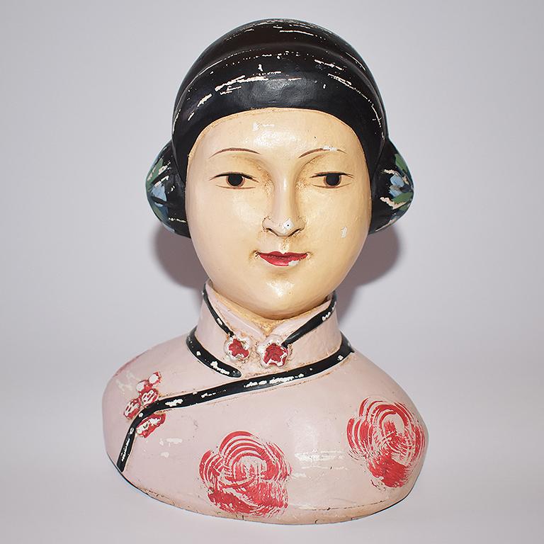 Chinoiserie style hand painted ceramic bust of a woman in wonderful vintage condition. This figural bust is created from chalkware and features a Chinese woman with dark hair pulled into two buns at each side. Her hair is black and accented with