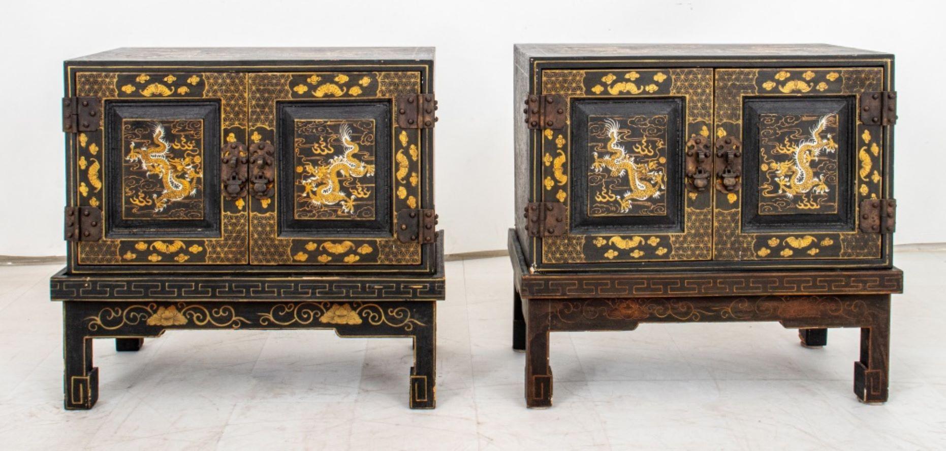Pair of Chinoiserie Black and Gilt-Decorated Cabinets on Stands, each with images of dragons and auspicious objects in gold, rectangular and each with two doors. 21