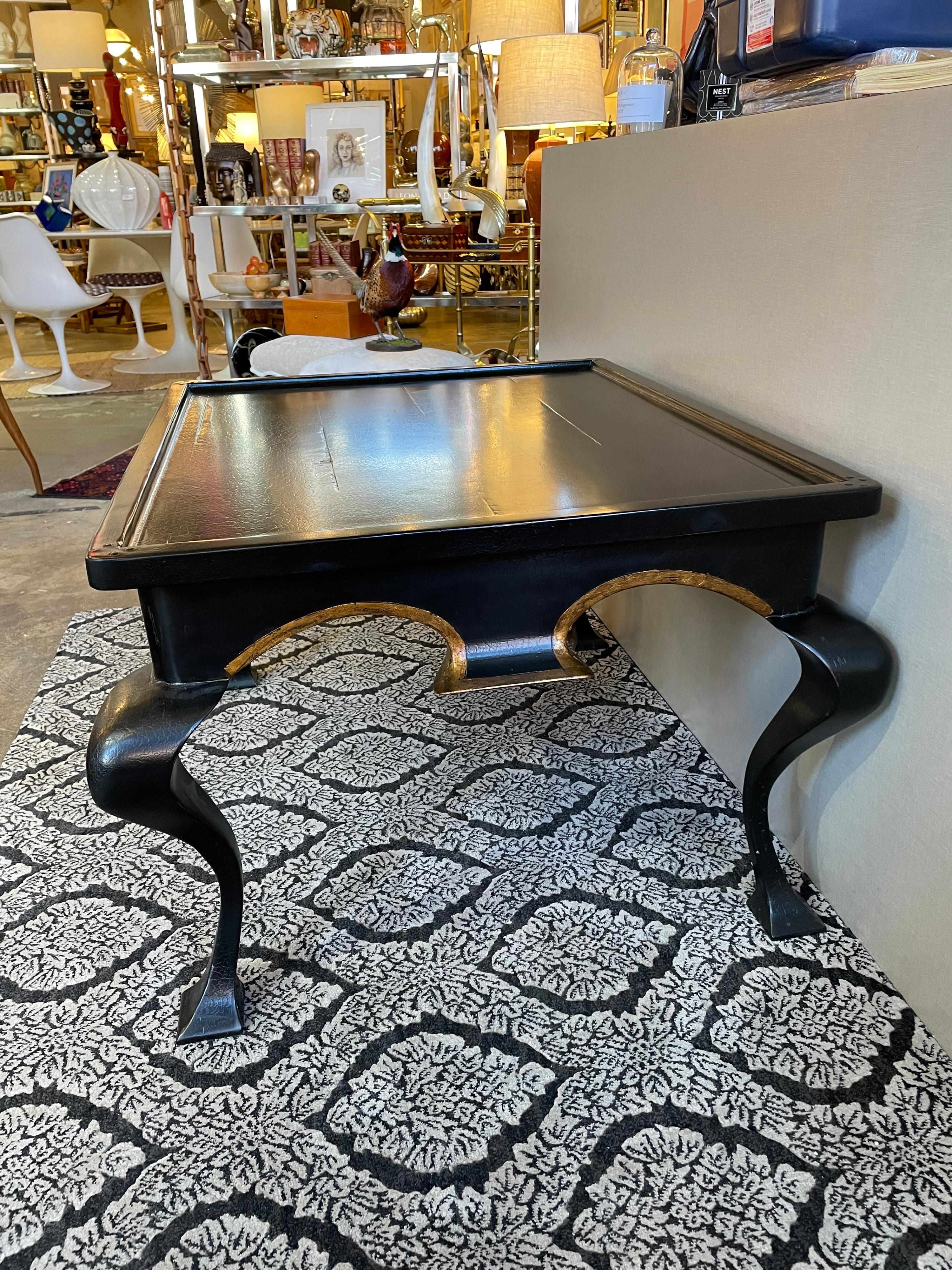 This is a beautiful lacquered black and gold coffee table from the 1990s.