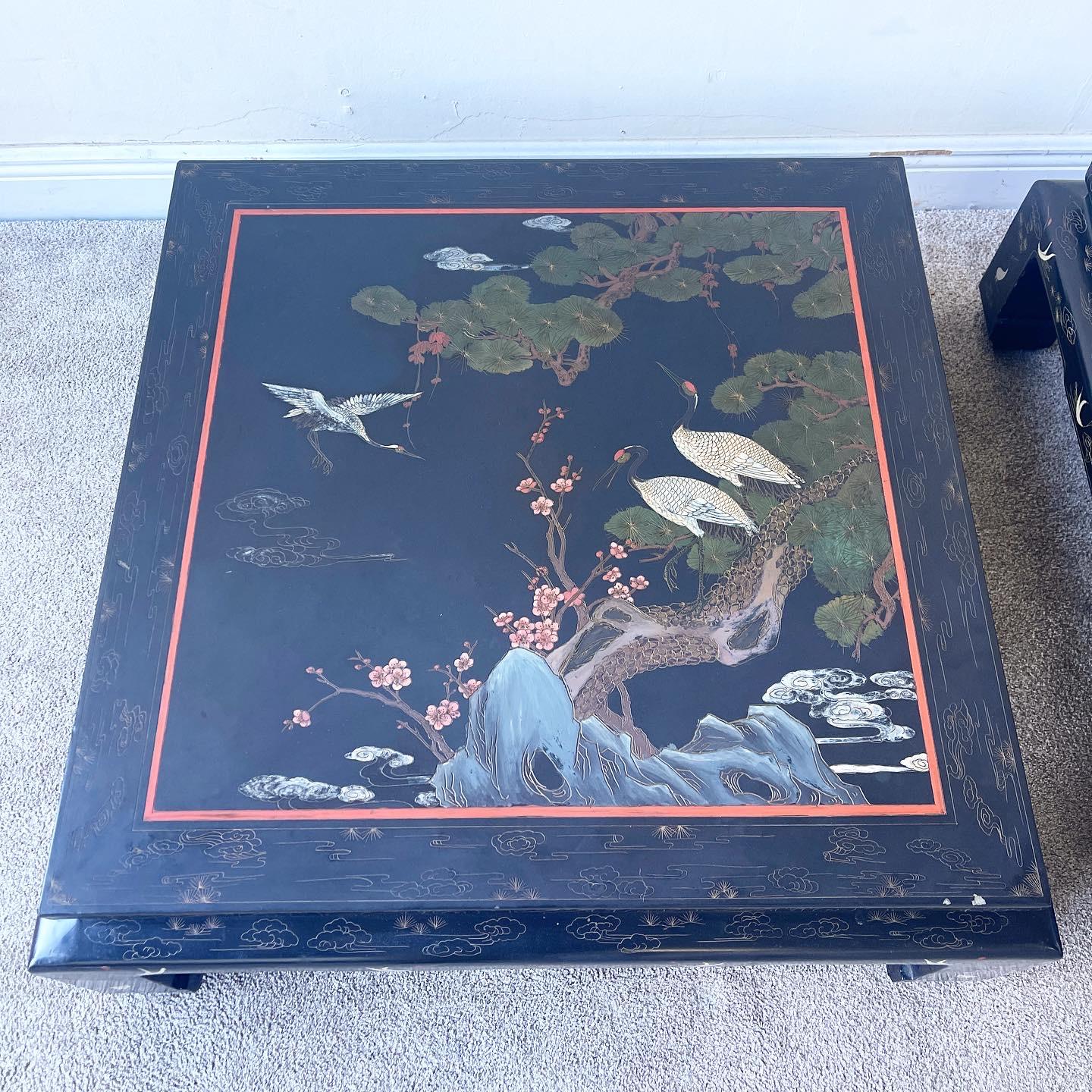 Amazing pair of black lacquered coffee tables made in Hong Kong. Stunning depictions of birds and nature hand painted onto each table.

Additional information:
Material: Lacquer, Wood
Color: Black
Style: Asian, Chinoiserie
Time Period: 1970s
Place