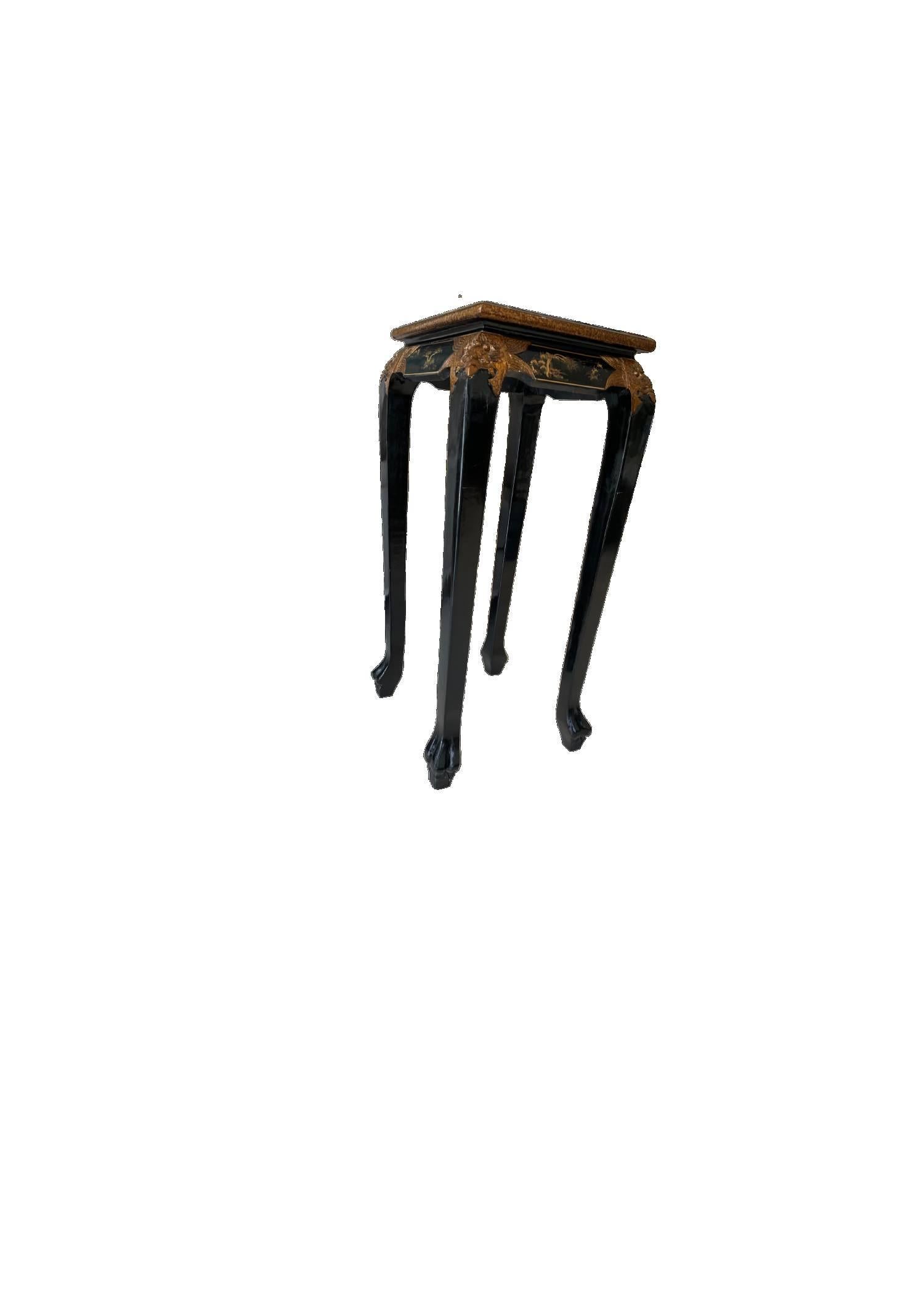 An elegant black lacquered pedestal table with gold trim - to display an “objet d’art” or to use as an elegant plant stand.