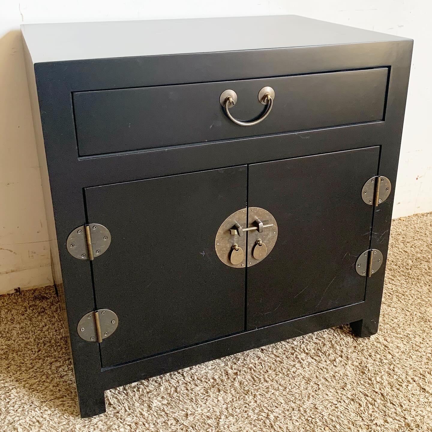 Embrace the sophisticated blend of East and West with these Chinoiserie Black Nightstands/Side Table, adorned with Brass Accents. The rich black finish and brass details provide a dramatic and elegant look, enhancing any decor from traditional to