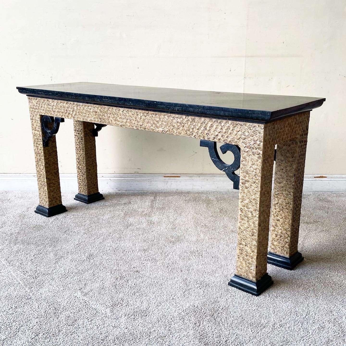 Exceptional vintage chinoiserie console table. Features a tessellated black stone top with a carved wooden frame.