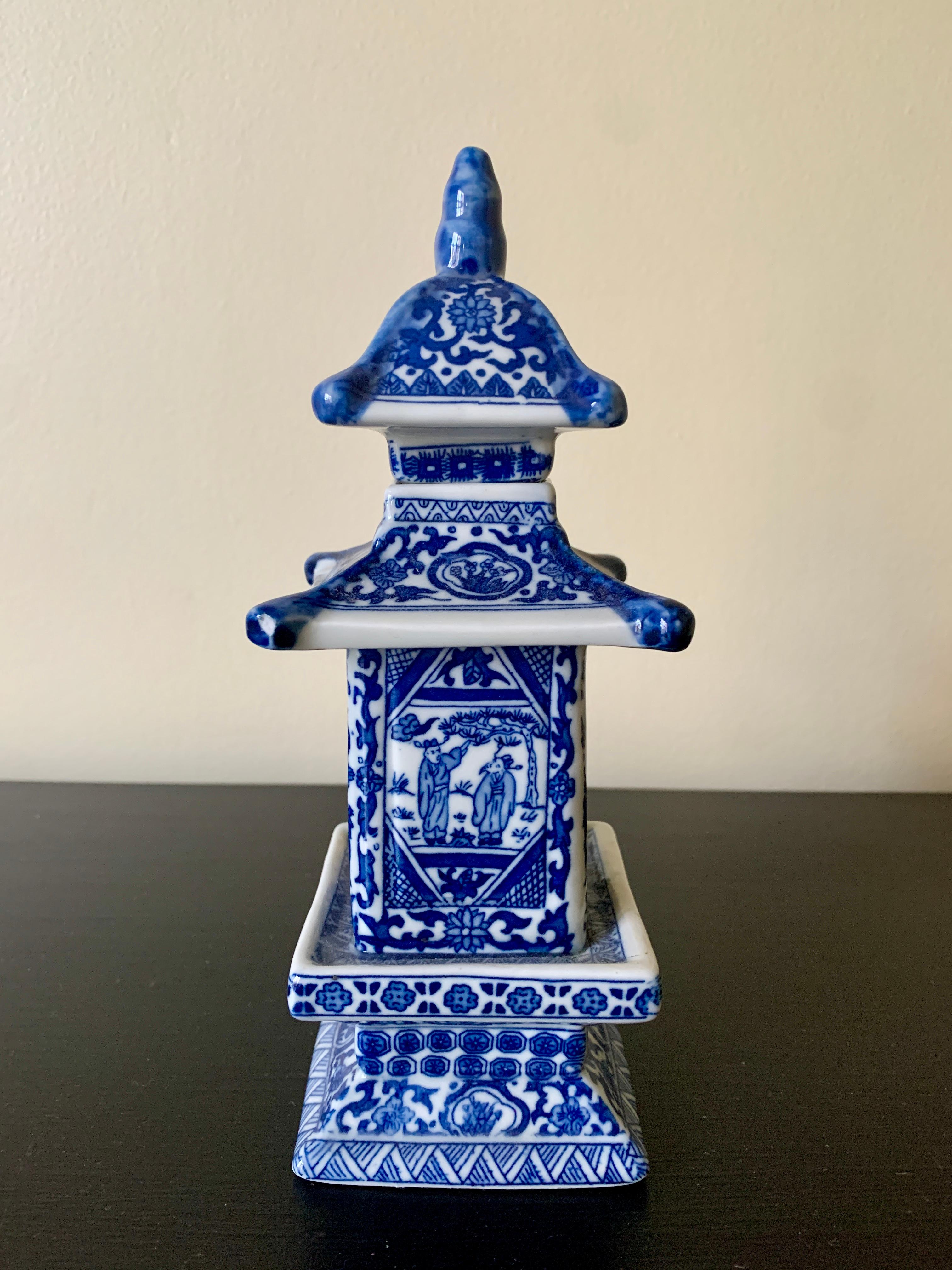 A gorgeous Chinoiserie blue and white porcelain pagoda jar with removable top.

China, Early 21st Century

Measures: 2.75