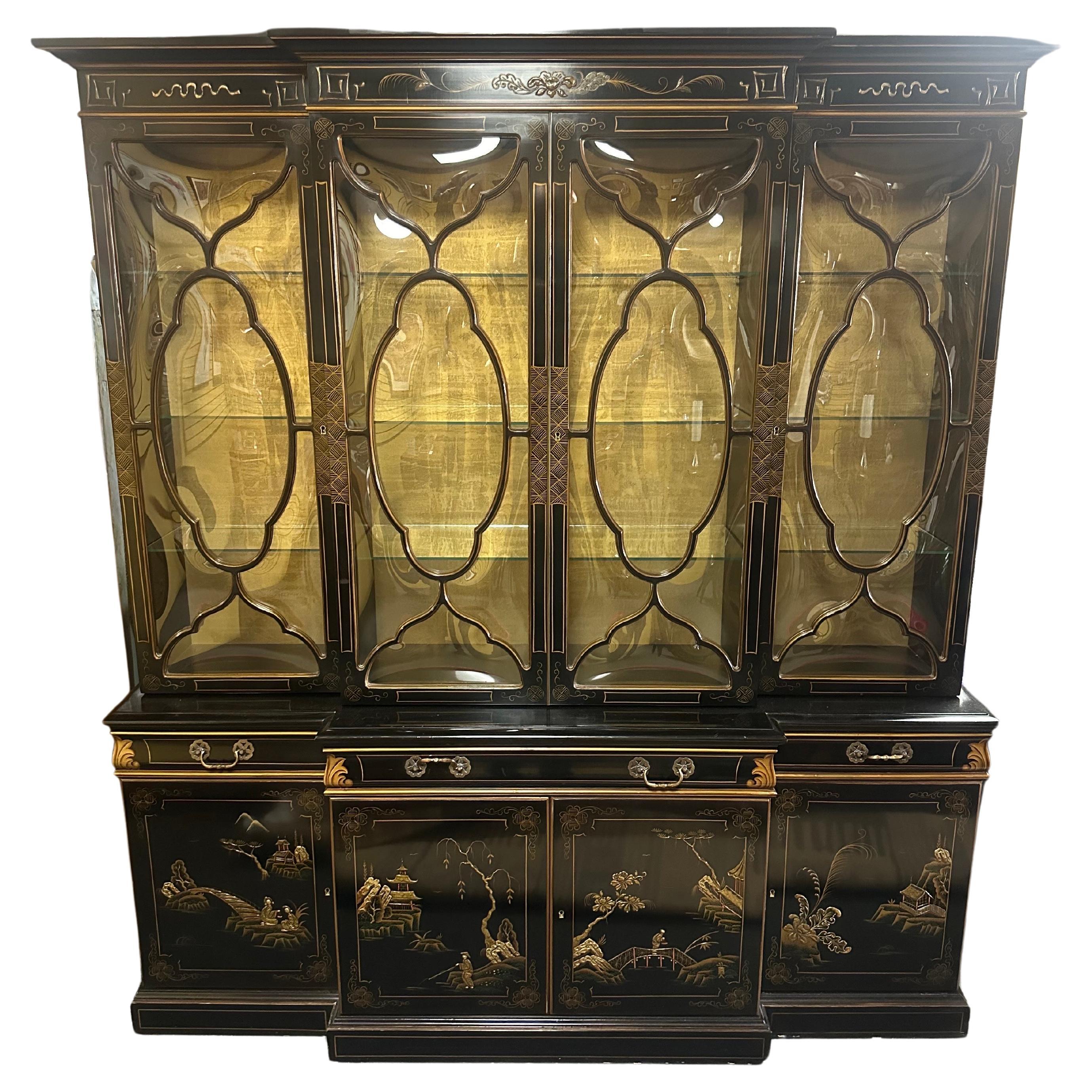 A absolutely stunning chinoiserie bubble glass china cabinet / breakfront by Karges, circa 1980s. This amazing piece has bubble glass, top lighting, a pull out leather top drawer / shelf and glass shelving throughout.  Comes with original keys.  The