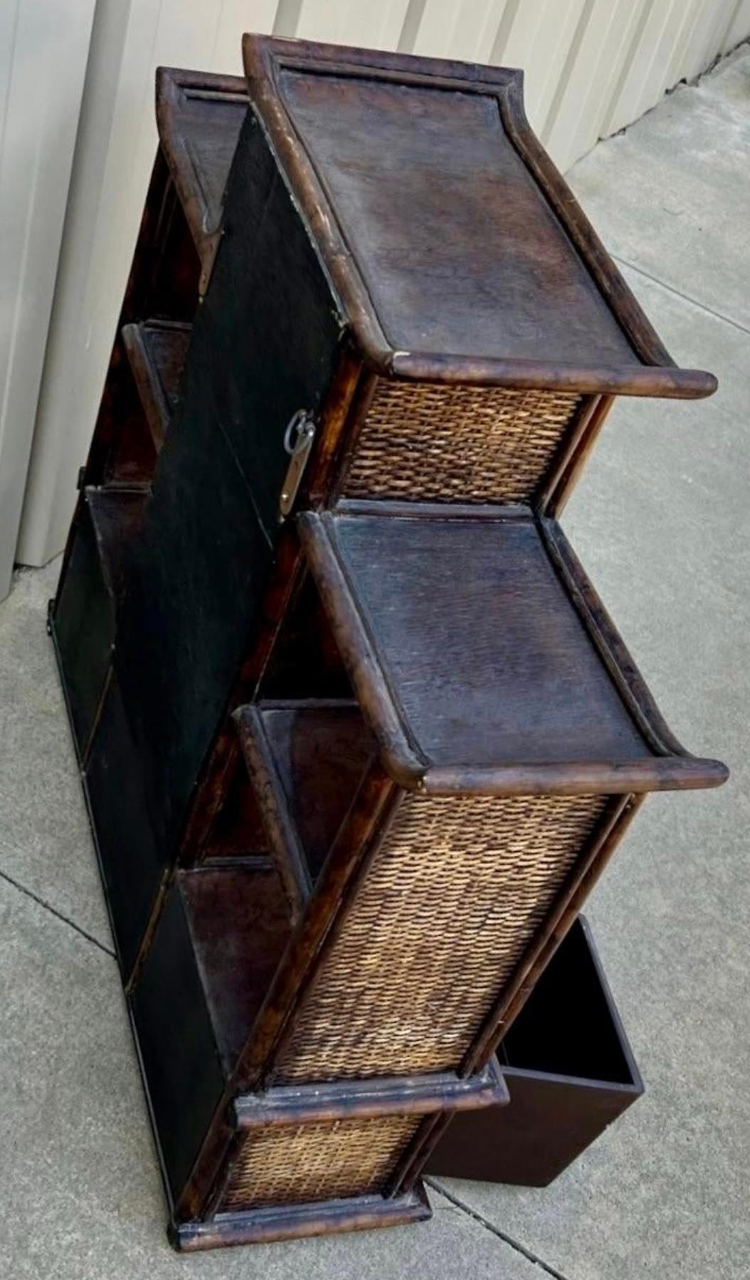 This a burnt bamboo pagoda form wall shelf attributed to Maitland-Smith. 
The shelf measures 28.5”L x 8”W x 27”H. It has two mirrored sections.
It is unmarked and in very good condition.