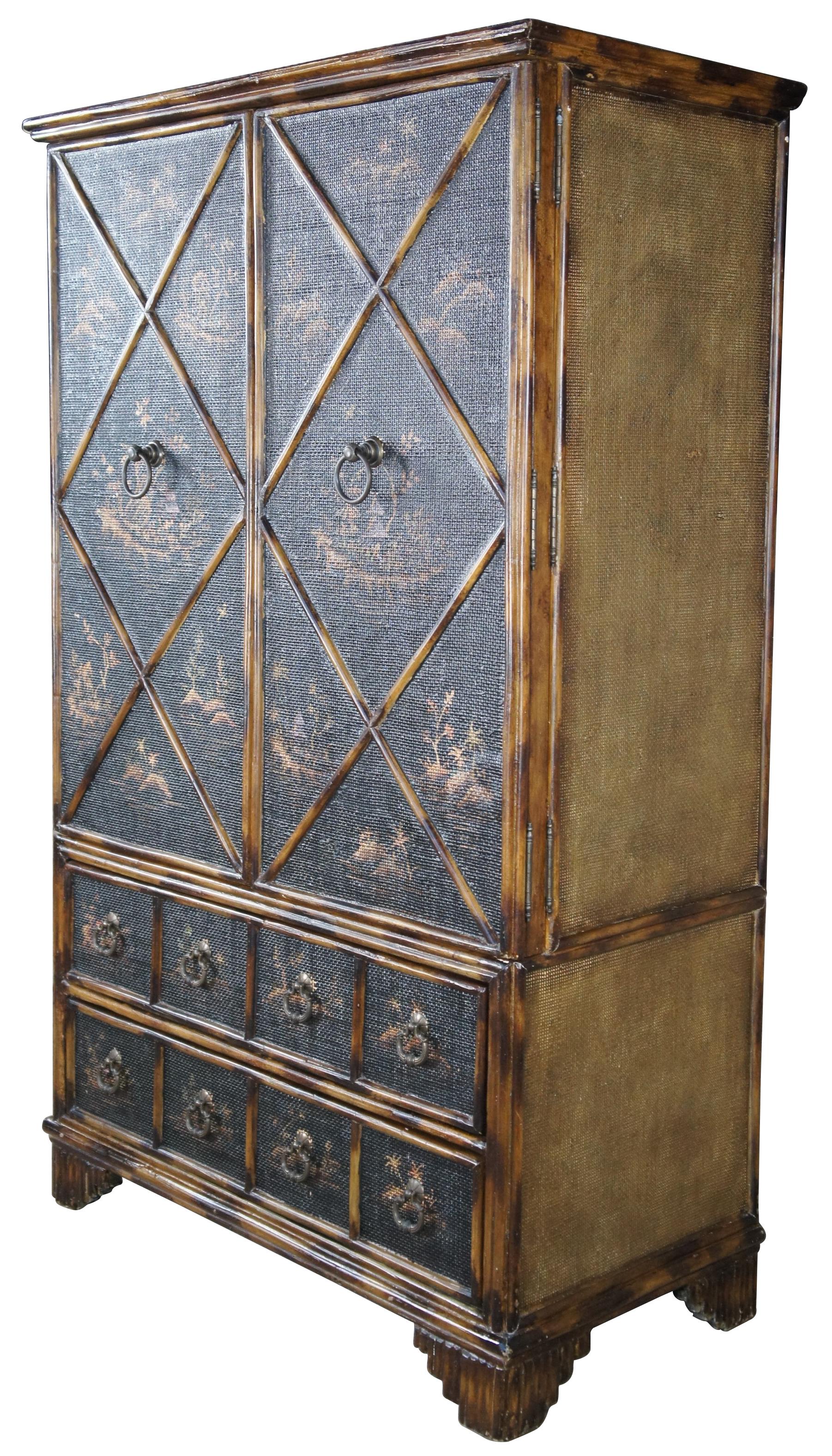 Vintage chinese armoire or mredia cabinet. Made from wood with a chinese chippendale style design featuring scorched faux bamboo and interlaced faux rattan along each side. The cabinet is finished with pagoda landscape scenes along each door. Double