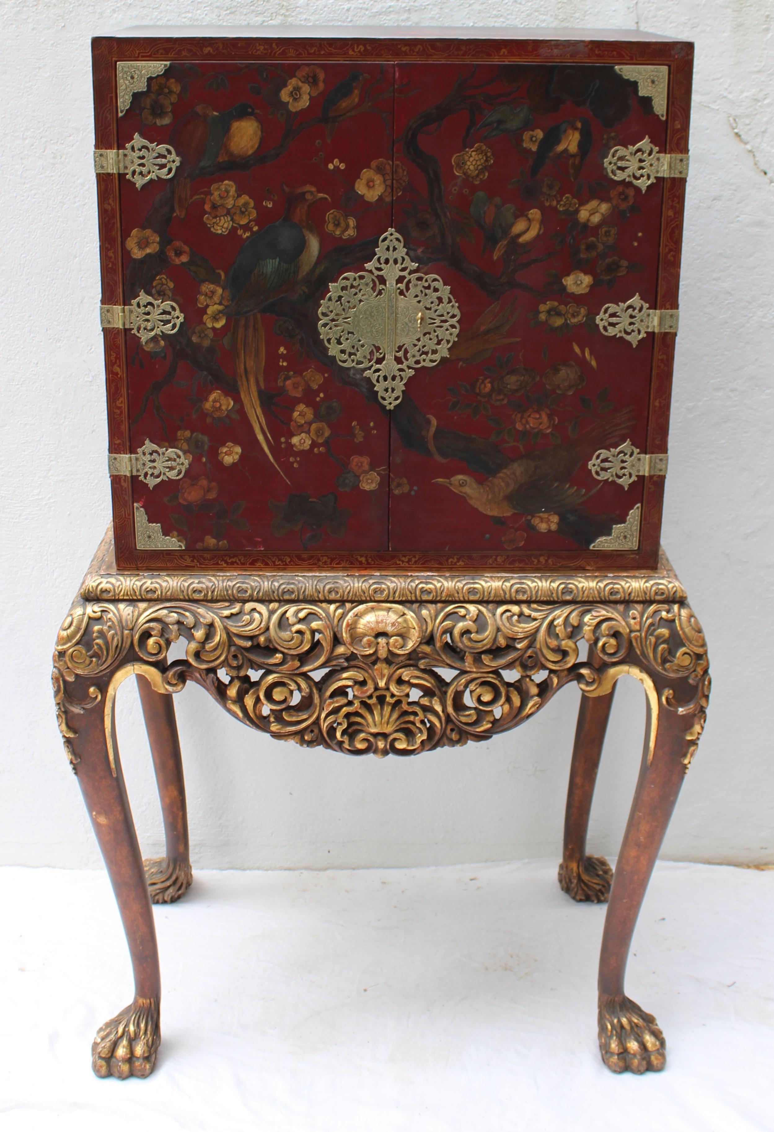 Two-door chinoiserie decorated cabinet on stand.

Cabinet without stand measures 29.75