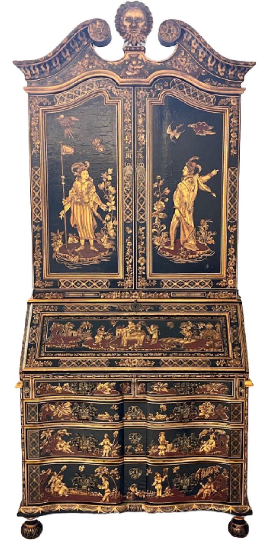 Chinoiserie carved black lacquer secretary desk having a black lacquer and gilt slant top and matching serpentine base. A simply stunning overstated piece having multiple compartments and painted raised carved detail throughout. The large center