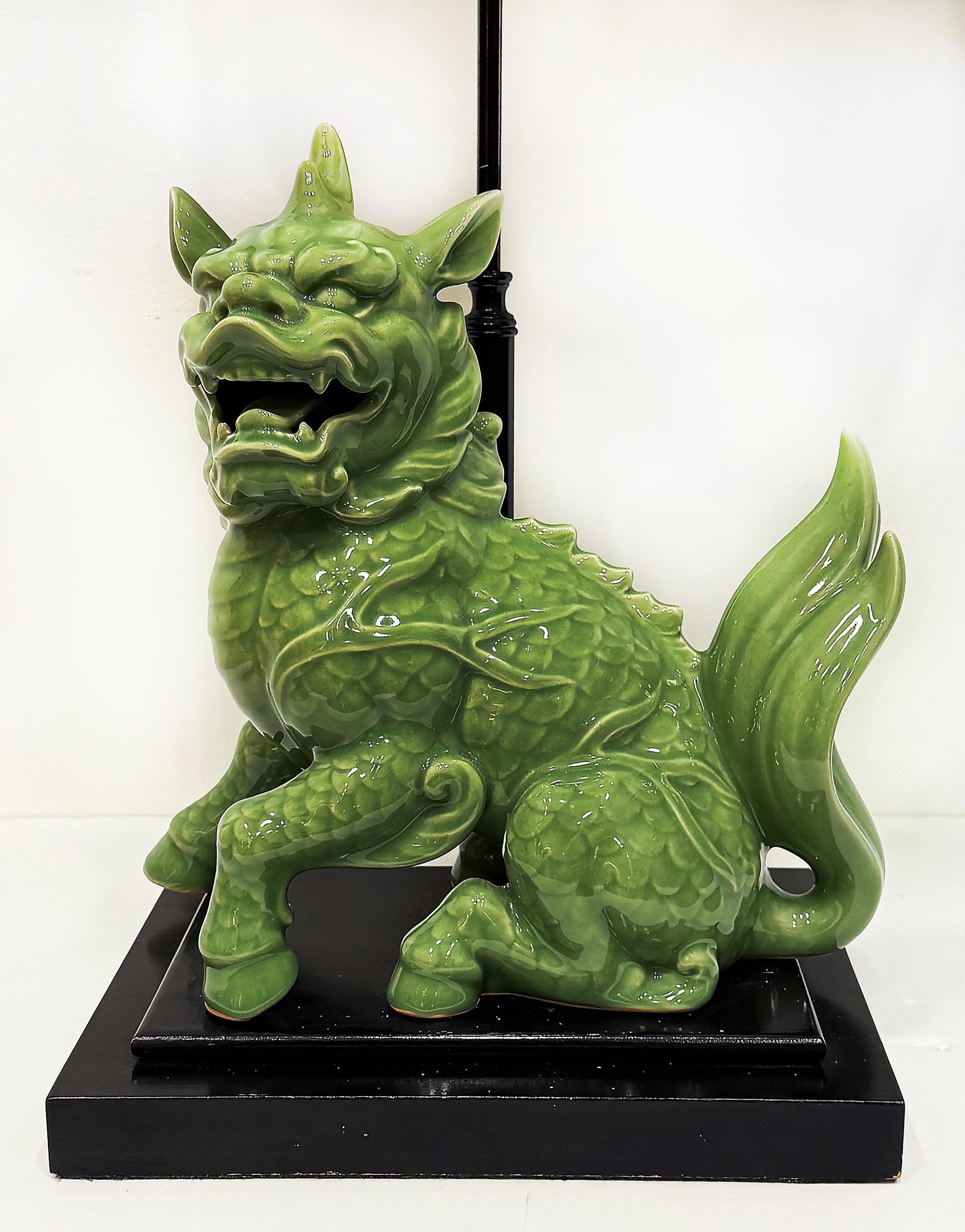 1940s Chinoiserie Celadon Porcelain Foo Dog Lamp, Custom Shade

Offered for sale is an early 20th century porcelain foo dog statue glazed in celadon green.  The food dog is mounted on a wood base and fitted as a table lamp. The lamp is completed
