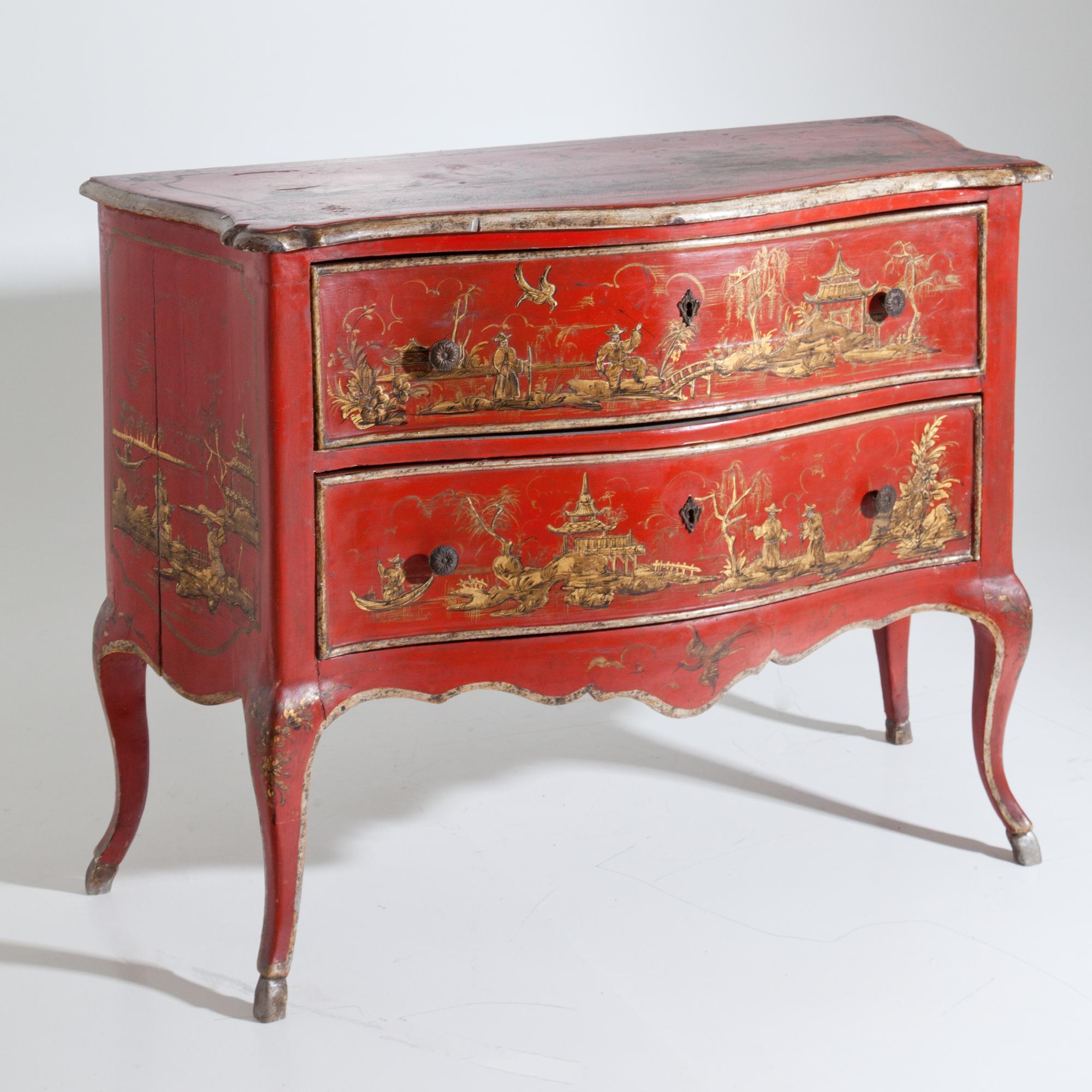 Two-drawered red lacquered chest of drawers in Louis Quinze style. The chest is slightly bellied and stands on s-shaped legs, the frame is also curved. The sides, shelf and fronts of the drawers are decorated with chinoiserie decors.
