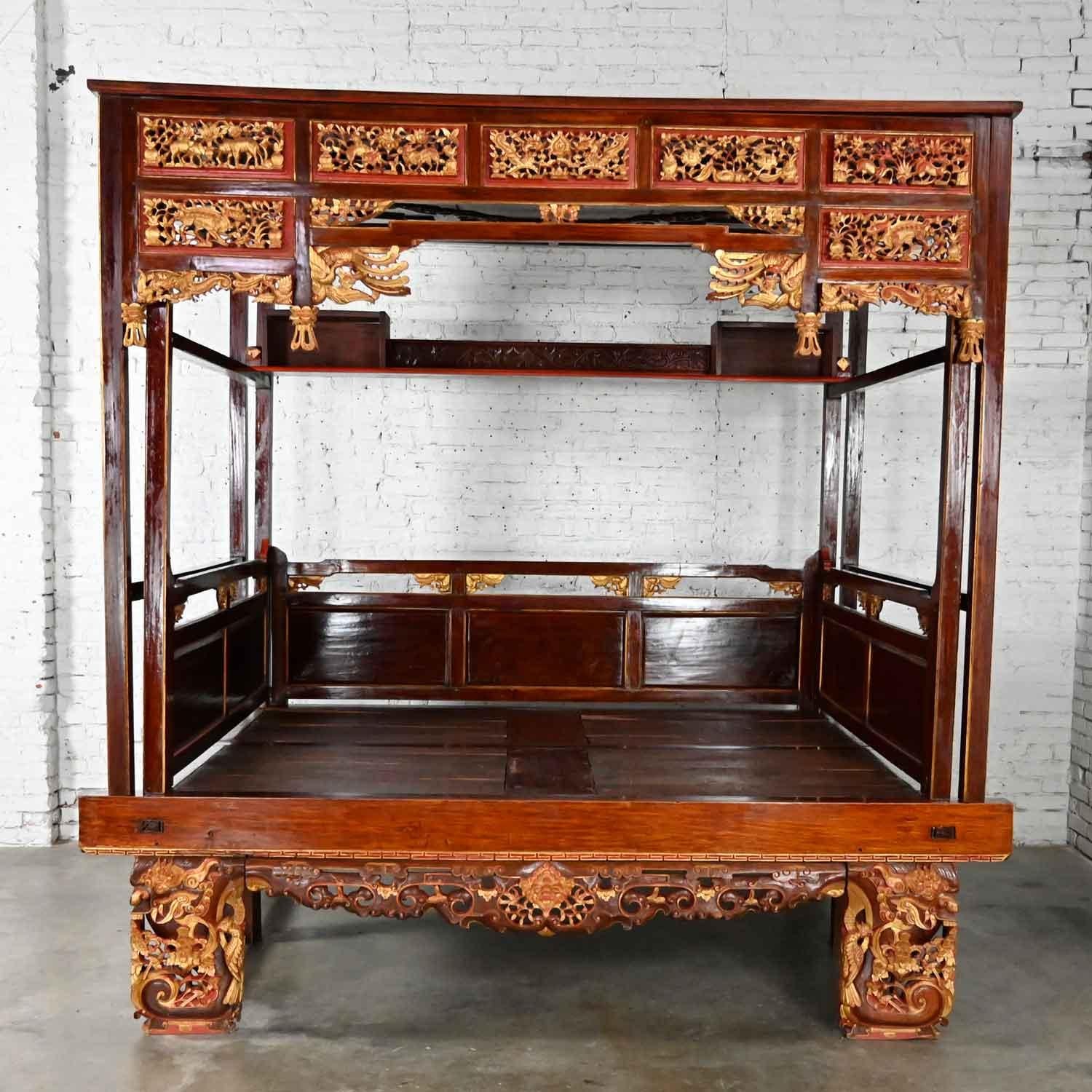 Phenomenal vintage chinoiserie Chinese Wedding opium canopy bed comprised of Chinese elm and all-over hand carved Asian gilded designs. It will hold a queen size mattress and is made up of 60+ individual pieces but will be shipped partially