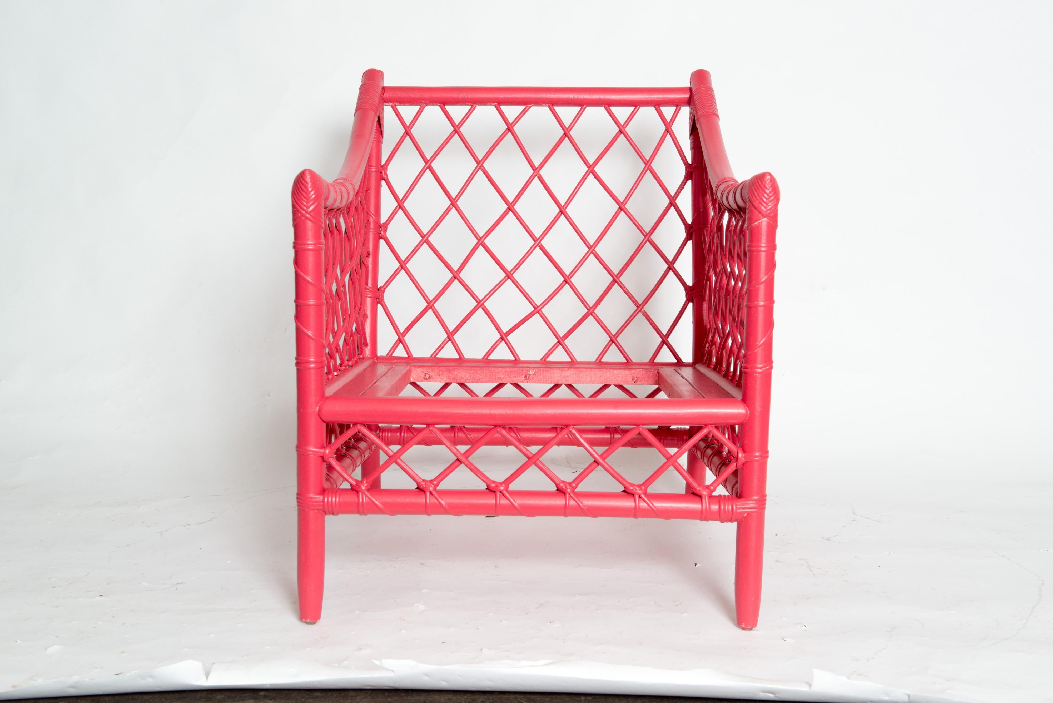 Chinese red woven rattan arm chair from Miami based Empire Rattan Company. The chair's rattan is woven in a large diamond pattern creating a striking appearance. Ready for your upholstered seat.
