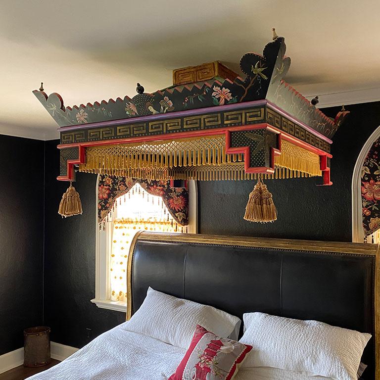 A large handmade chinoiserie pagoda bed canopy with gold fringe details. Custom created for a historic Oklahoma City home, this bright bed canopy brings a stunning addition to any bedroom. It is square in shape and created from wood. It affixes to