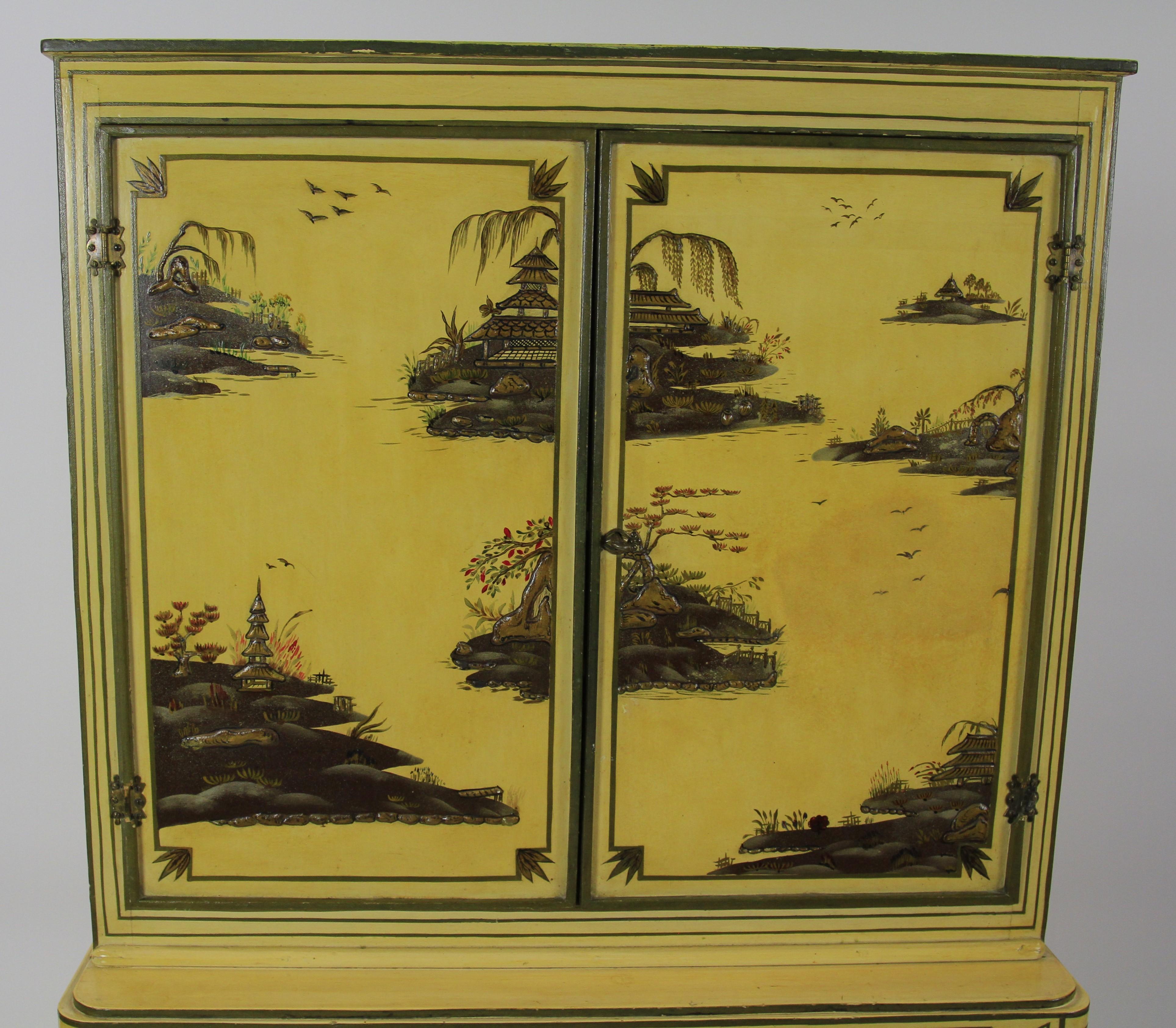 Chinoiserie Decorated 4 door cupboard circa 1900
Cream In colour 
4 doors with gilt frames,
Working locks with key, open to Reveal:
Shelf interior
Gilded Line & x pattern detail on front of cupboard
Good original chinoiserie decoration