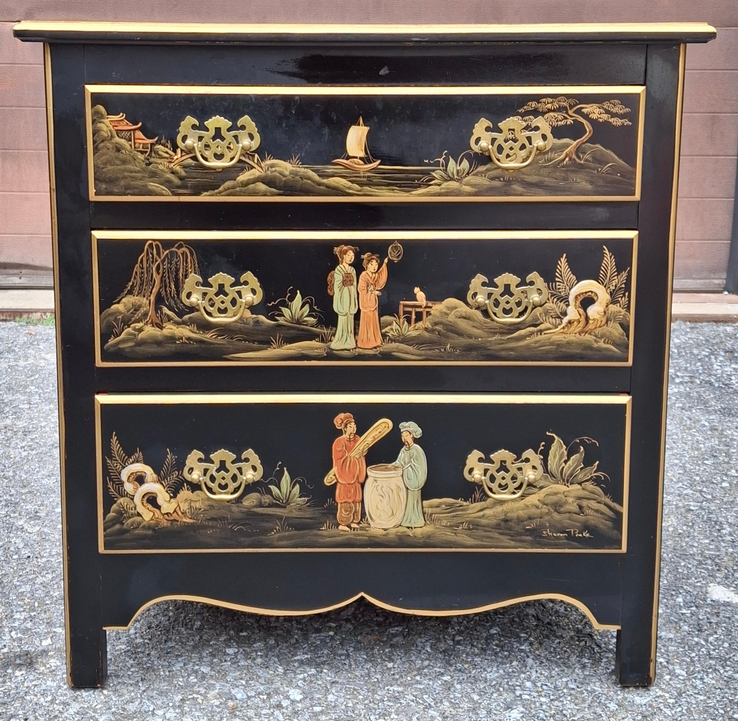 A late 20th Chinoiserie Decorated and Ebonized Wood Side Chest, Hand Painted Signed Sharon Peake. Thre flawlessly operating drawers. Top drawer equipped with Reed and Barton Anti tarnishing Silver clothes.
Measures 24.5
