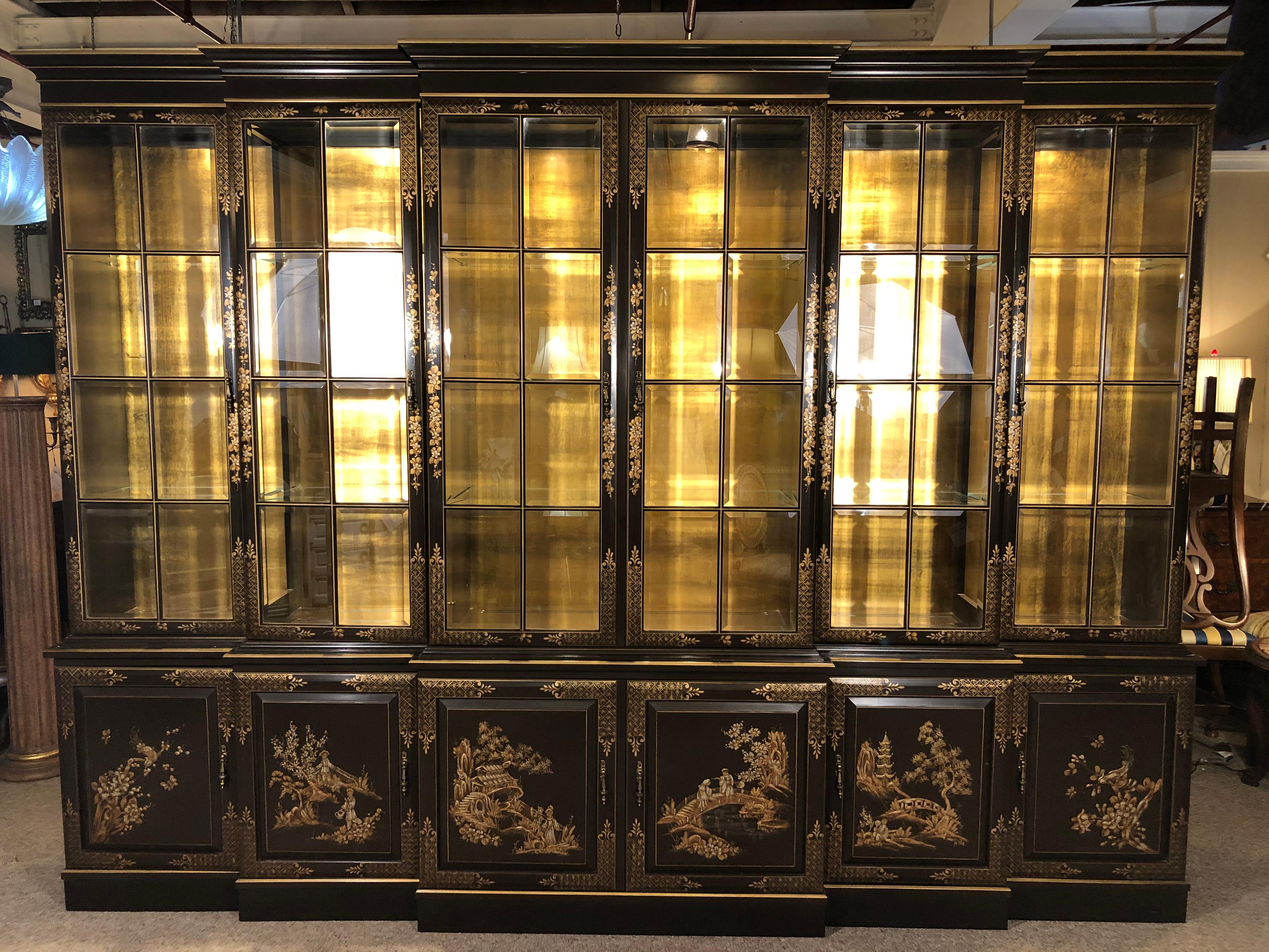Chinoiserie decorated breakfront bookcase cabinet. An almost ebony chocolate background and design decorated Chinoiserie style breakfront or bookcase cabinet. Having 6 parts with multiple adjustable glass shelves and beveled glass paneled doors.