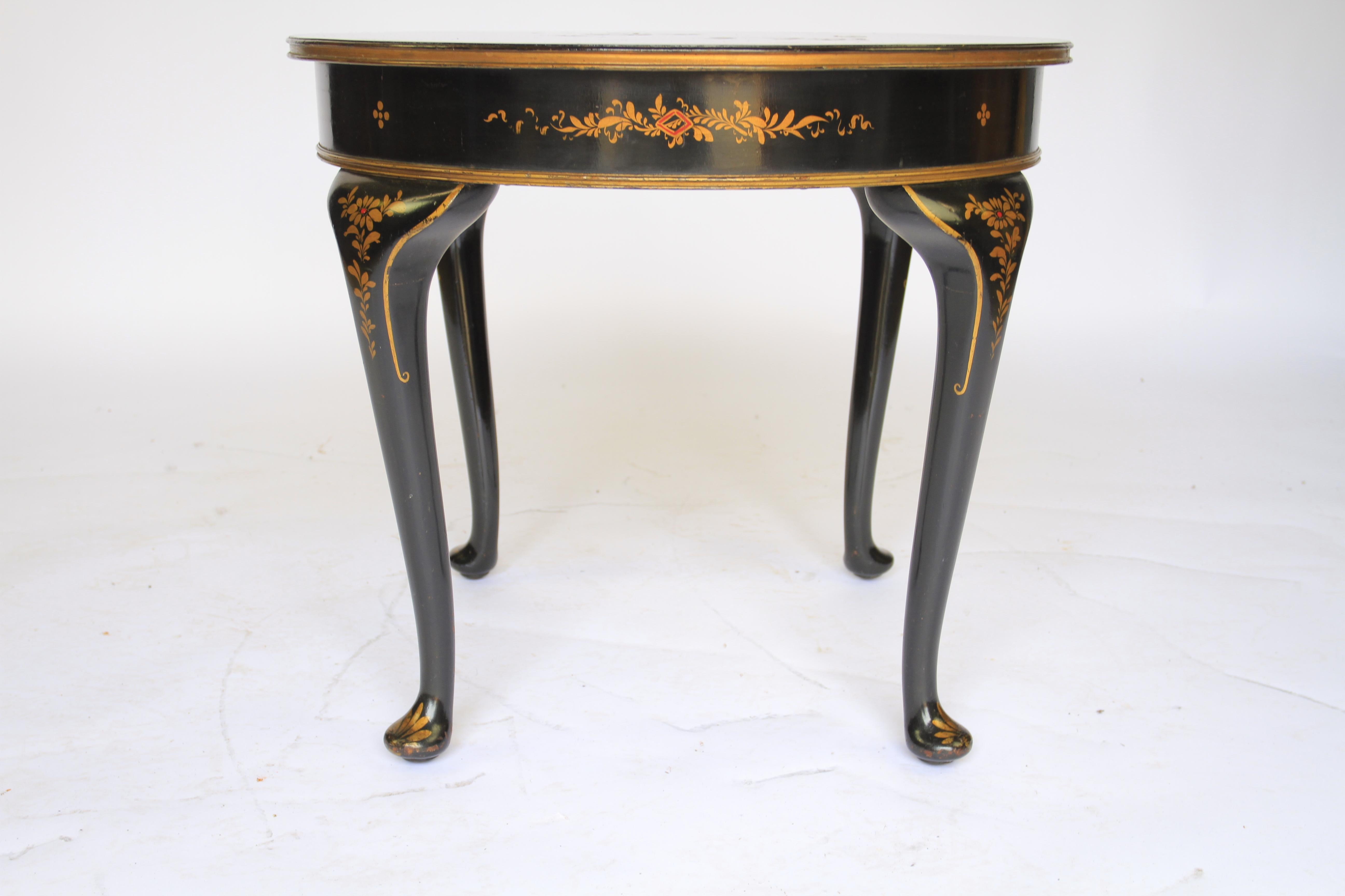 Chinoiserie decorated coffee table circa 1930s
Black background, 
gilt  Chinoiserie decoration
Depicting Figures & landscape scene
Gilt decoration around frieze & legs
Very good original condition