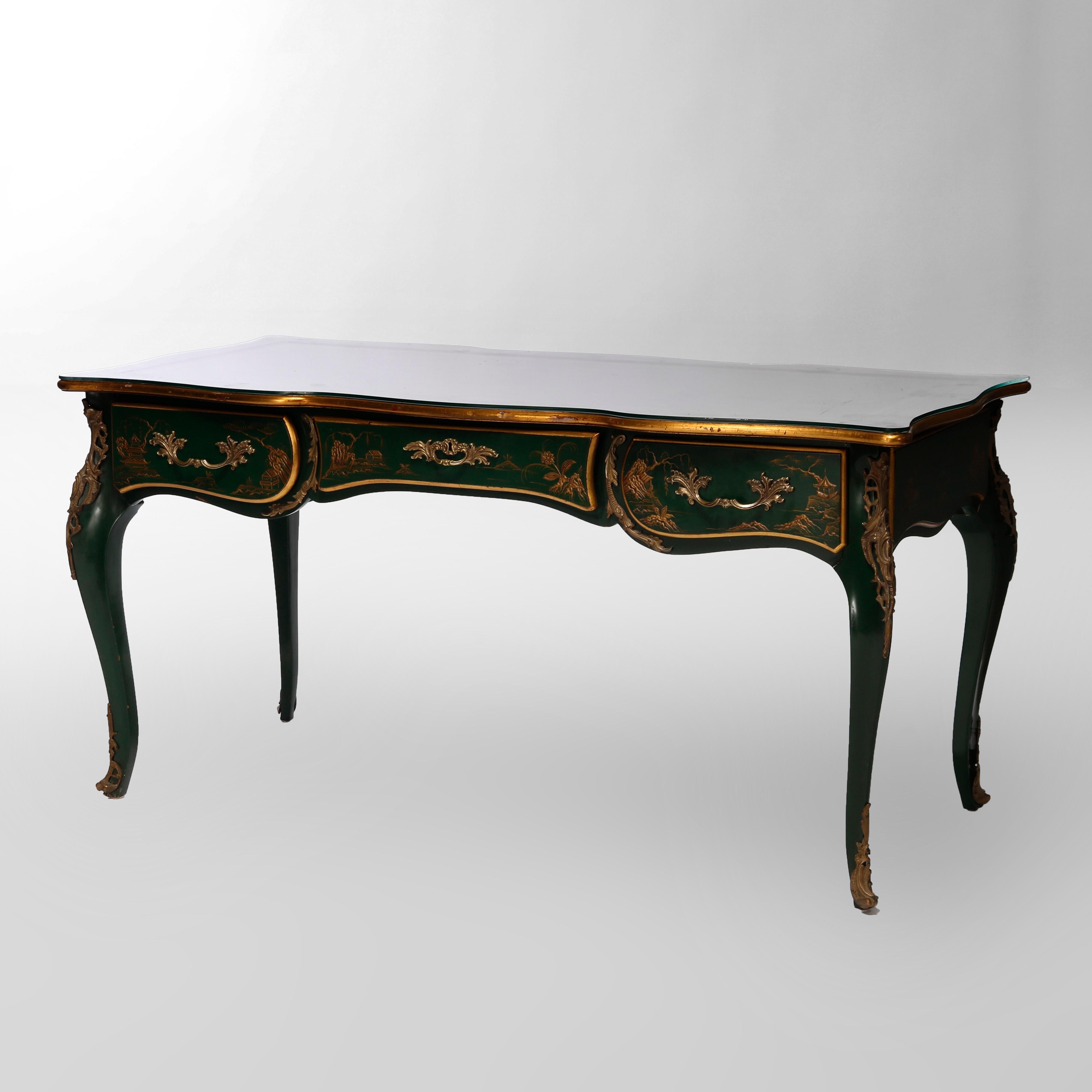 A bureau plat desk by Karges offers shaped top having gilt decorated leather writing surface and gilt trim over Chinoiserie decorated base having single drawer, raised on cabriole legs, foliate cast ormolu mounts throughout, maker label on drawer