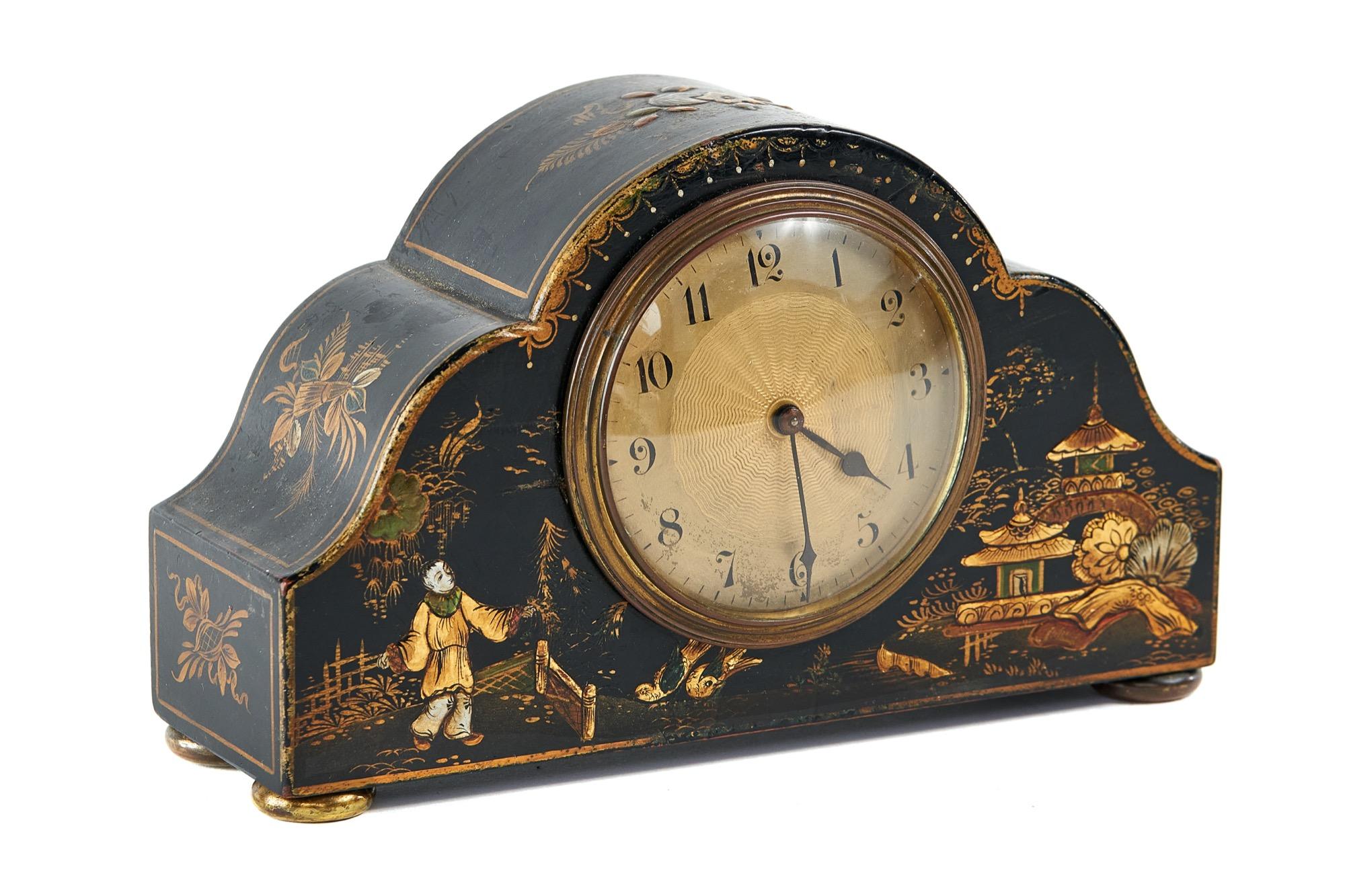 Black chinoiserie decorated mantel clock, circa 1920s.
 Gold plated dial with circular centre with engine turned detail.
Dome shaped glass with brass rim
8 day French movement. With key
recently serviced with key
keeps good time.