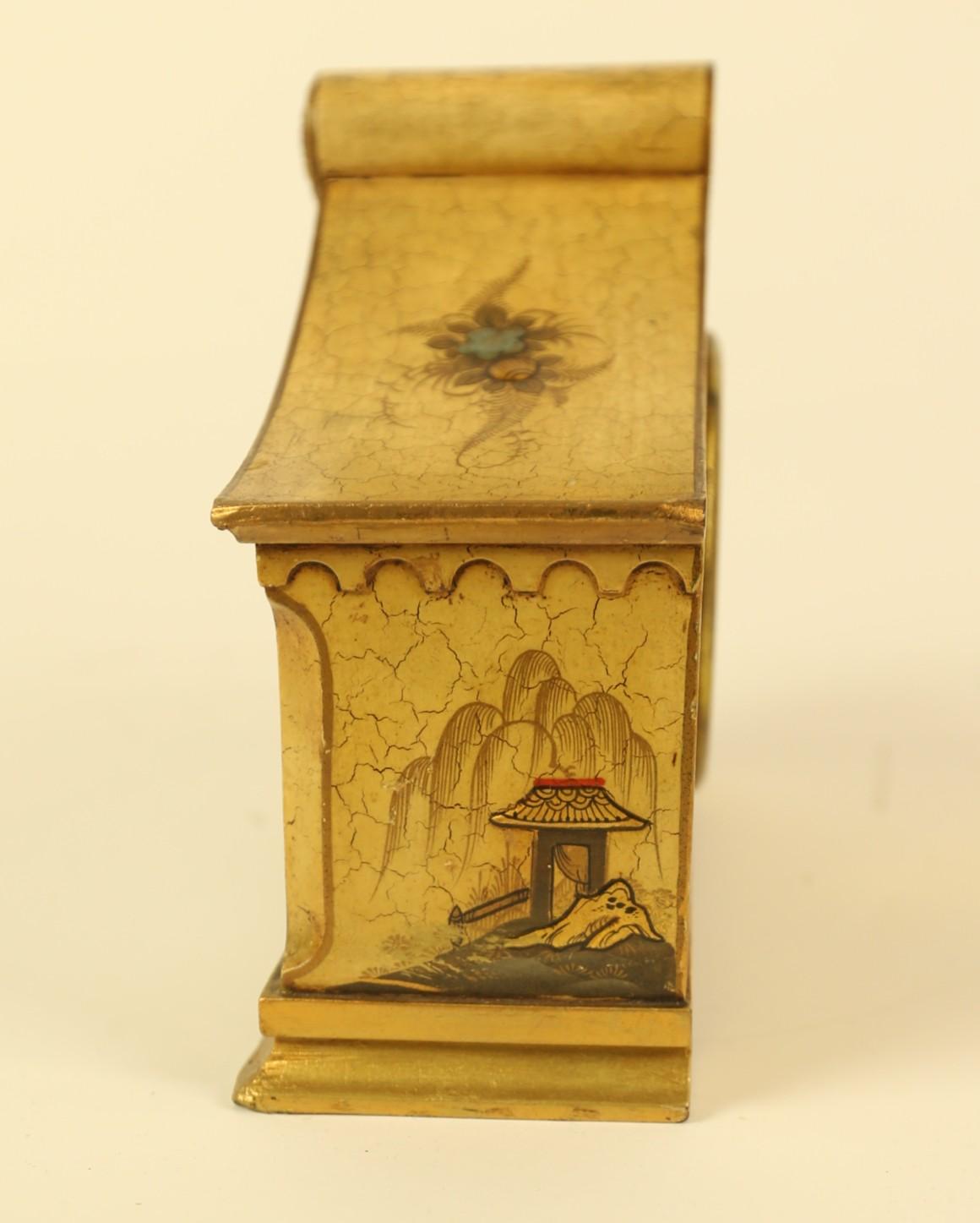 Chinoiserie decorated Mantel clock circa 1930s
Cream in colour
Top with Scroll shaped pediment
Decoration With, Flowers, Foliage, Figure, Bridge & Building
Circular  enamel dial, Dome shaped glass
French 8 Day Movement.
Good Original