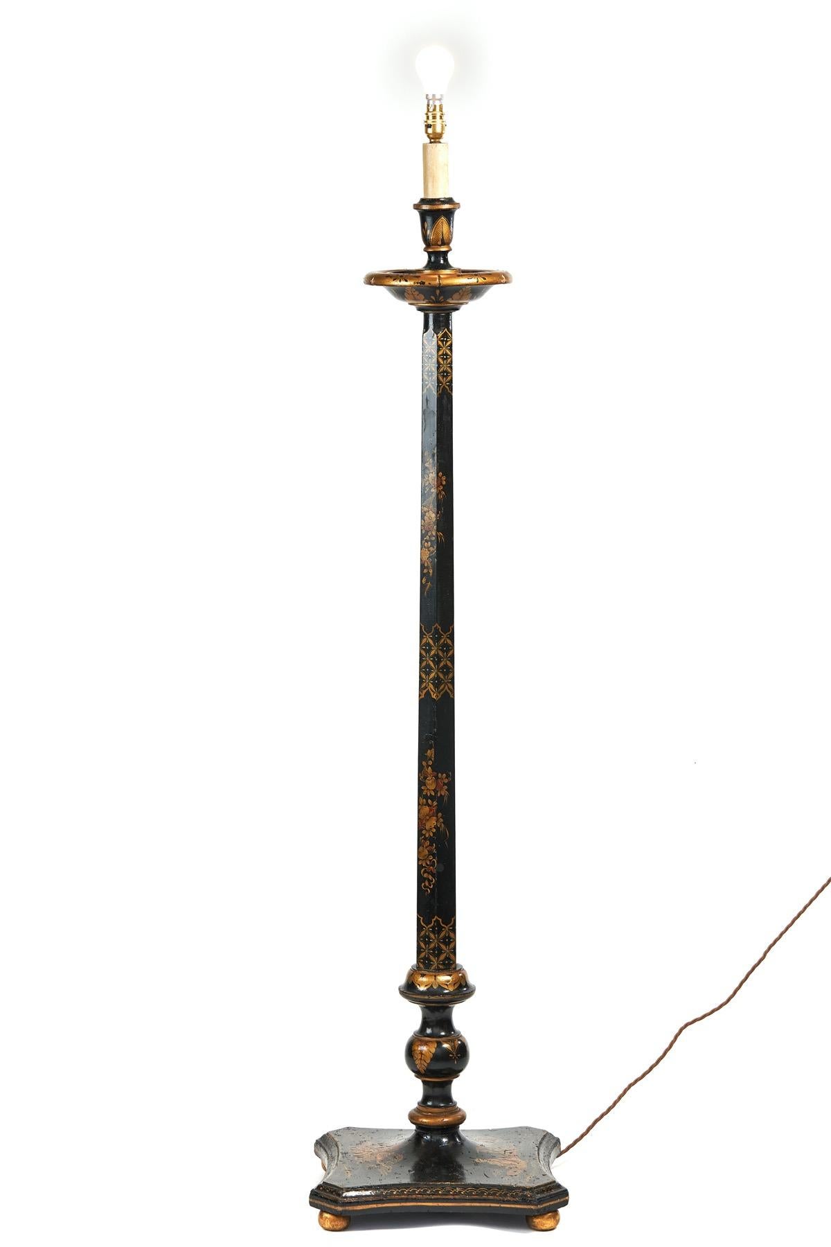Chinoiserie Decorated Standard Lamp circa 1930s
Black & gold in colour, 
Turned & Tapering Column. Decorated with Gold Lattice Pattern & Floral & leaf detail
Square Shaped Base Decorated with Figure, House, Trees & flowers & Foliage
Sitting on 4