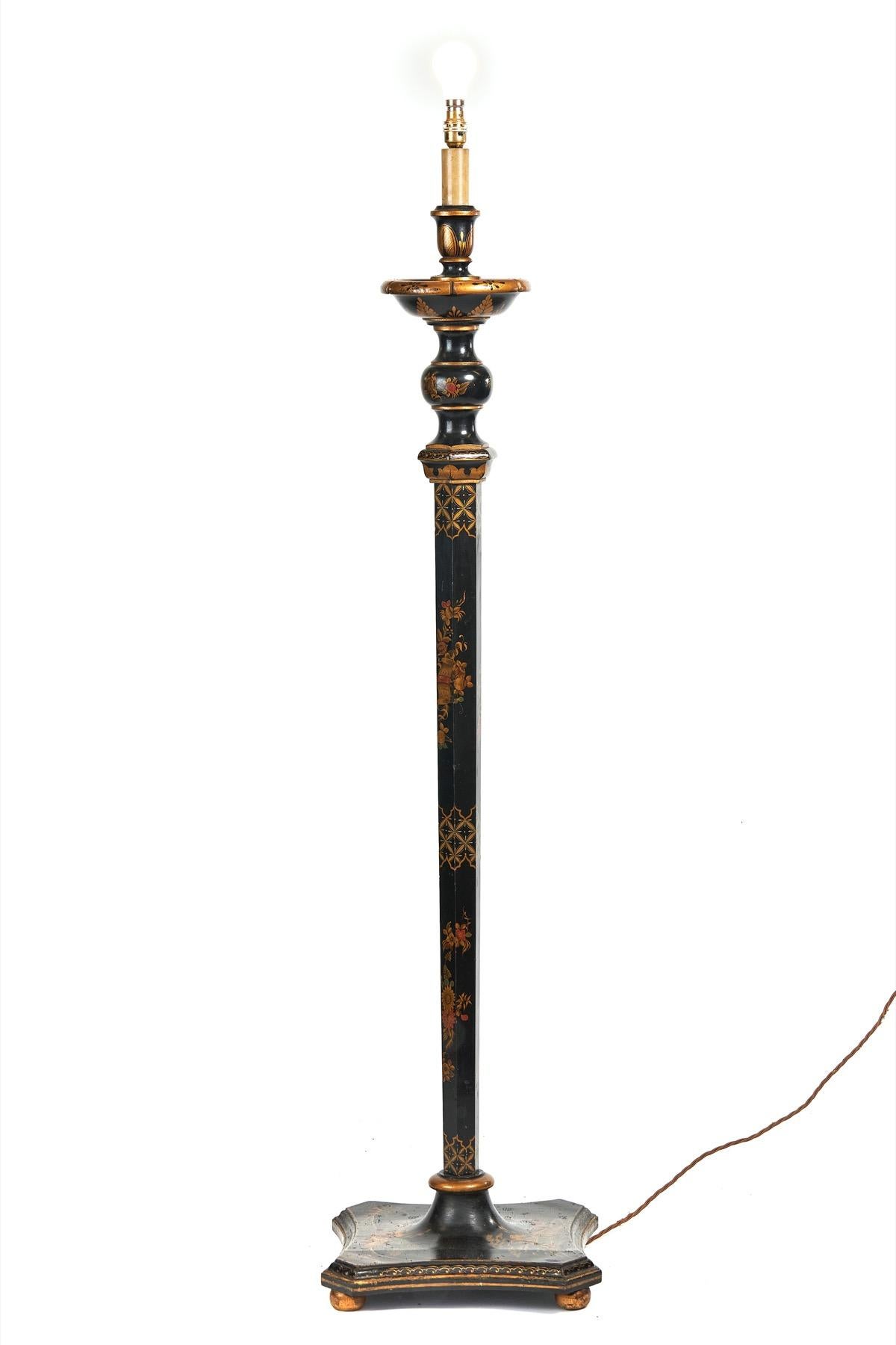 Chinoiserie Decorated Standard Lamp circa 1930s
Black & gold in colour, 
Turned & Tapering Column. Decorated with Gold Lattice Pattern & Floral & leaf detail
Square Shaped Base Decorated with Birds , Trees & flowers & Foliage
Sitting on 4 gold