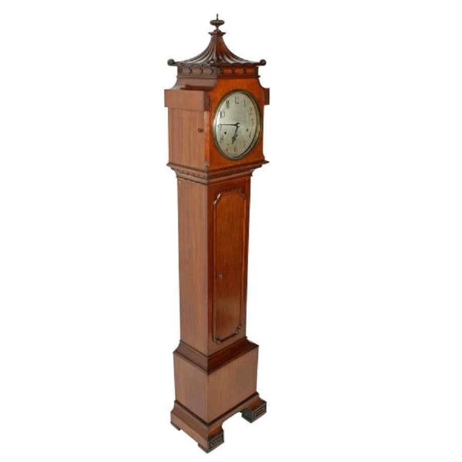 An early 20th century mahogany cased Chinoiserie designed chiming Grandmother clock.

The clock case is mahogany and has a pagoda shaped top to the hood.

The German made 8 day works strike the quarters and hours with a Westminster chime on