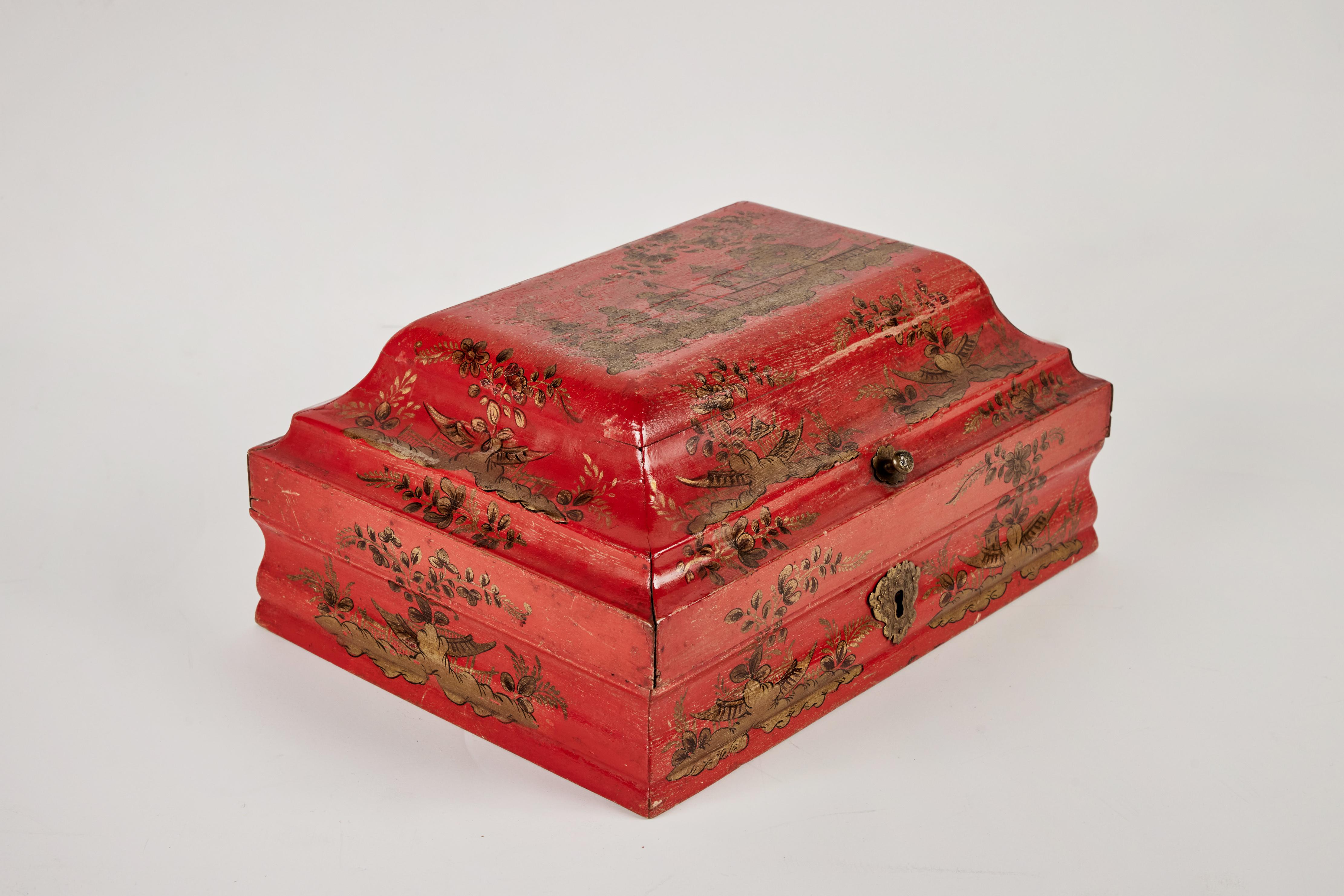 Hand painted, parcel gilt and lacquered, hinged wig box. Top design features 2 figures in a garden with a pagoda.  Original hardware.