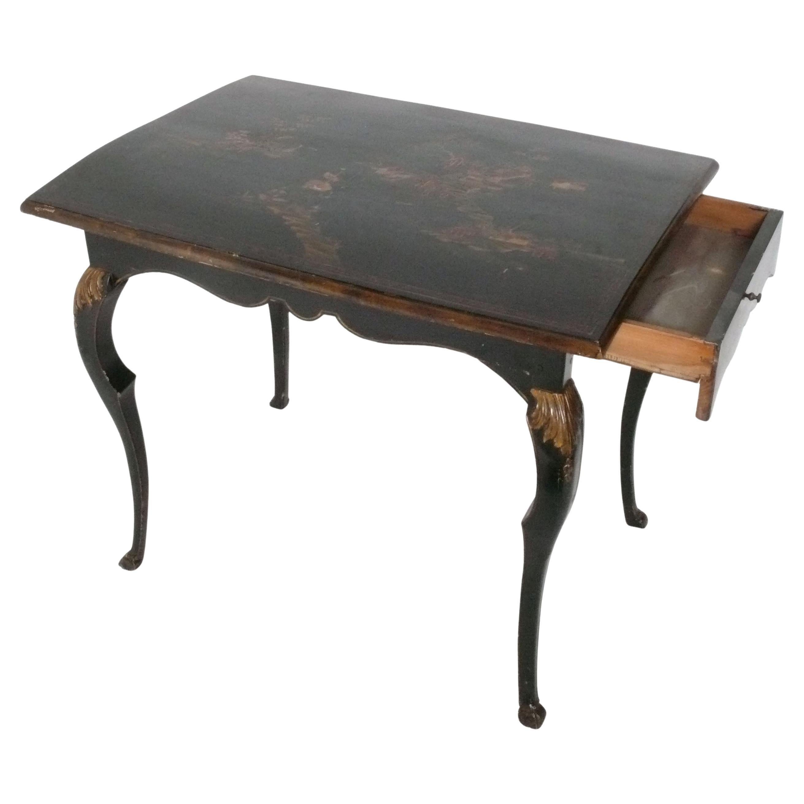 Elegant Chinoiserie Desk and Chair, French, late 19th Century. Both feature hand painted details. The desk or table is a versatile size and could be used as a desk or console table. The table top on the desk is warped upwards. The chair is an