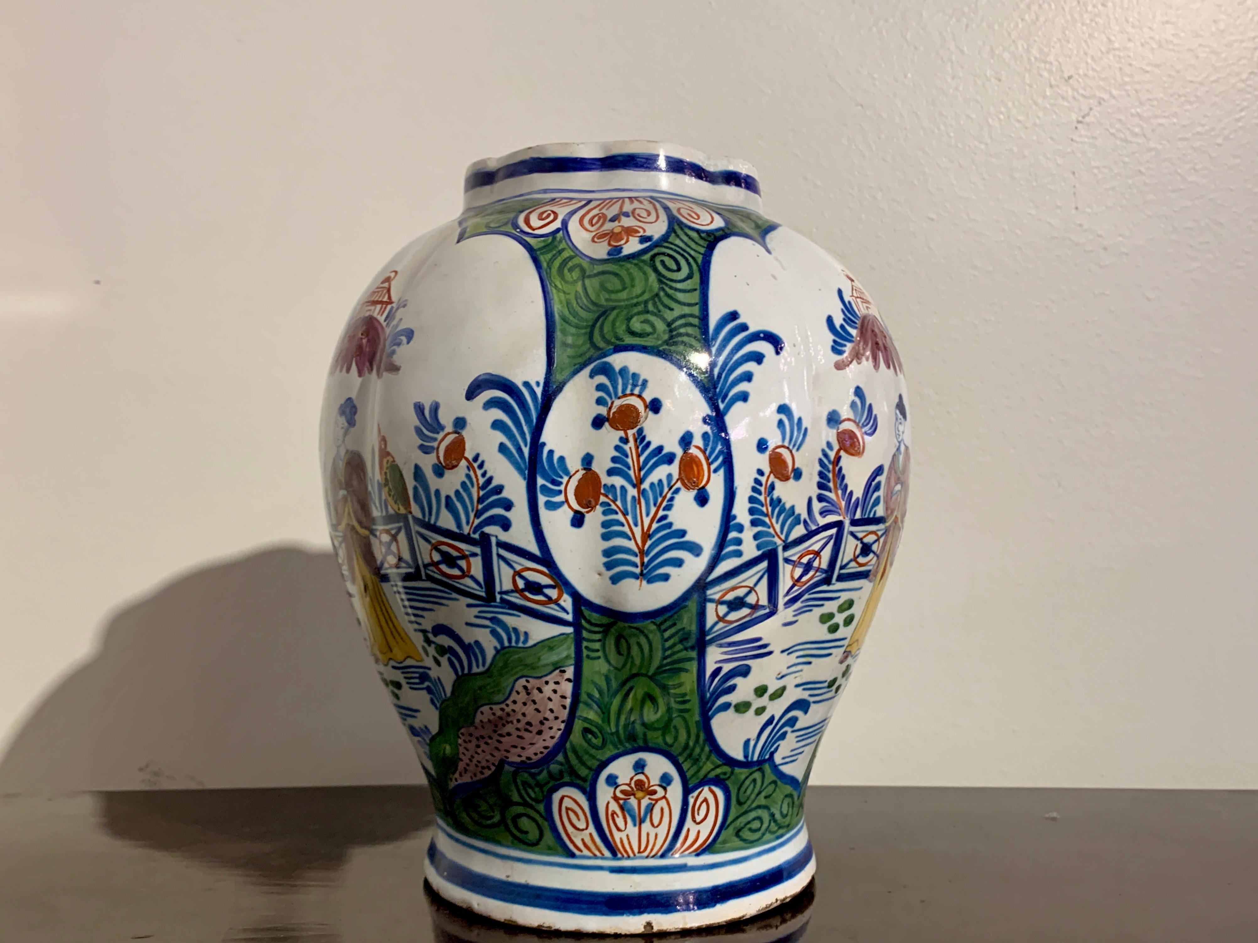 A charming Dutch Delft ginger jar of lobed form, with chinoiserie design in polychrome tin glazed enamels, 18th century, Holland. 

The ginger jar (missing its lid), of globular form with a lobed body. The body decorated in fanciful polychrome tin