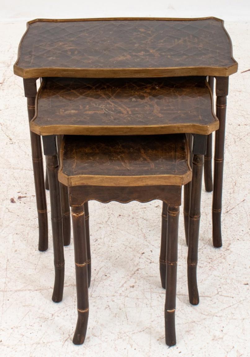 Group of three faux bamboo wood nesting tables, each decorated with different landscape scene to top. 

Dealer: S138XX.