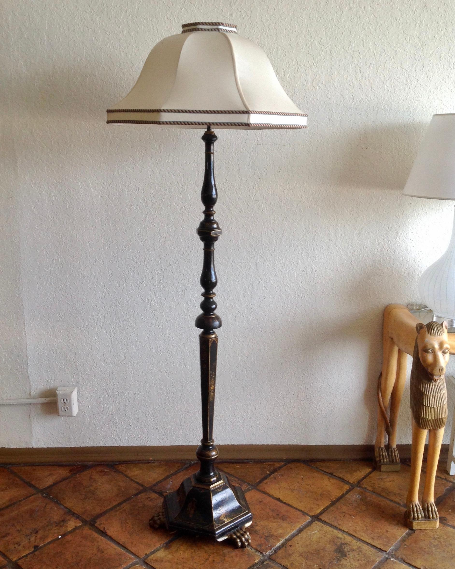 Stunning design, raised upon giltwood paw feet and featuring fine pen work.
Accented with a bell form shade.
Measures: Shade is 24