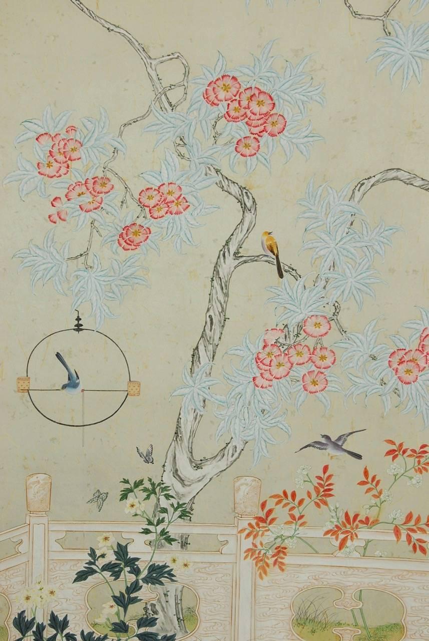 Stunning pair of chinoiserie flora and fauna hand-painted screen panels by Robert Crowder (American 1911-2010). Each panel features intricately detailed flowers, birds, and butterflies over a textured, pearlescent mulberry paper background. A large