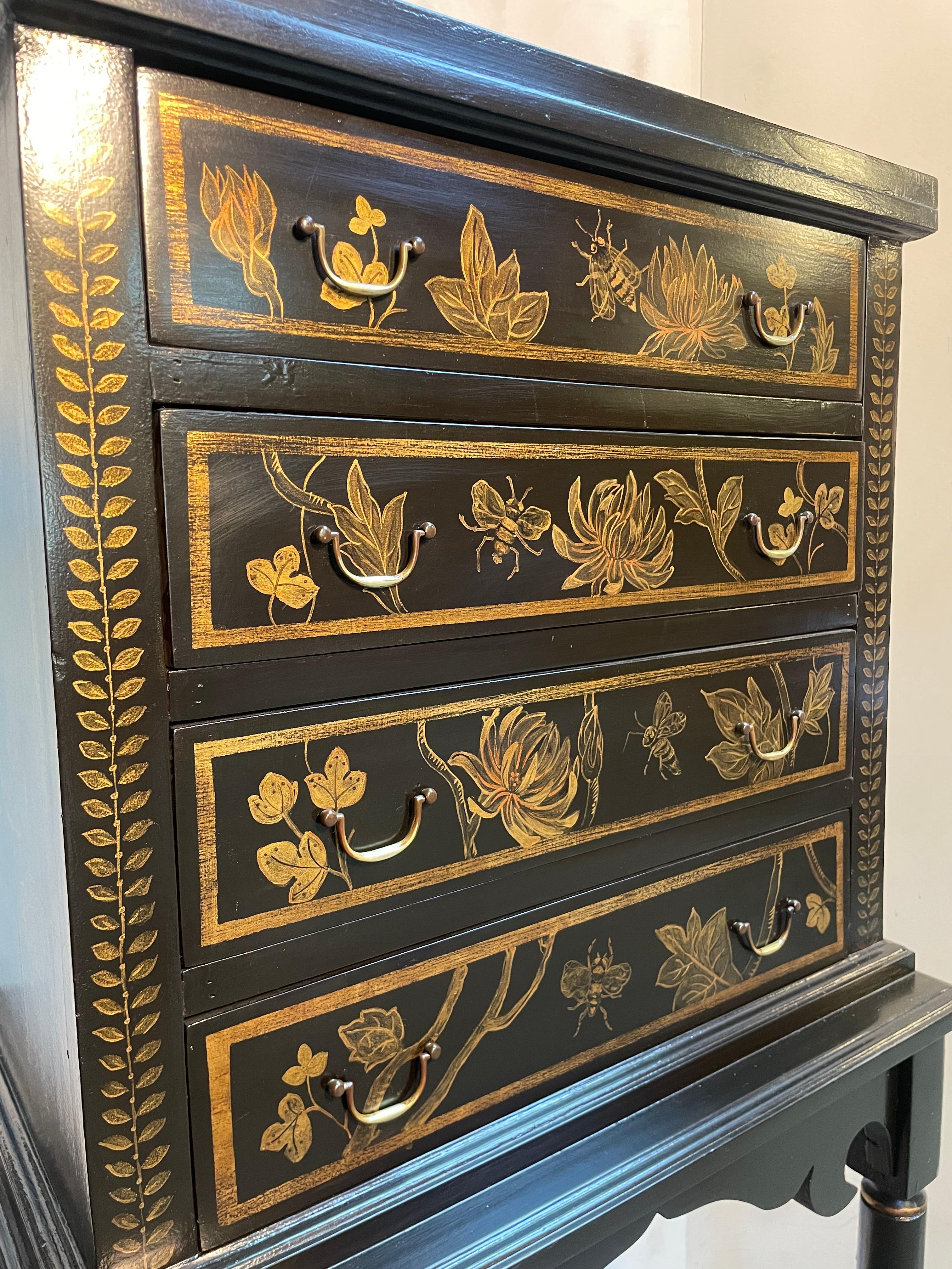 Made in the late 19th century to early 20th century, this beautiful floral 4 drawer chest on a detachable stand is a must have for your home. All of the chinoiserie gold foliage design was hand painted; giving it more of an organic energy. The