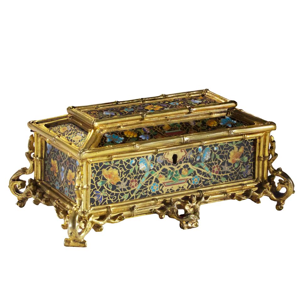 Unusual and Ornate Gilt Bronze Champlevé Enamel Lidded Casket. After a bamboo box, this champlevé box contains five enameled faces with gilt bronze  bamboo trim and tree branch feet. Each face contains a black background with gilt stems and branches