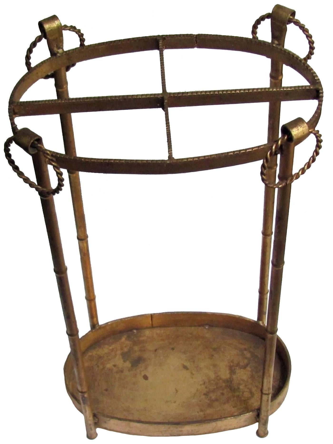 Midcentury Chinoiserie gilt metal faux bamboo umbrella stand. Light overall wear from age and use.