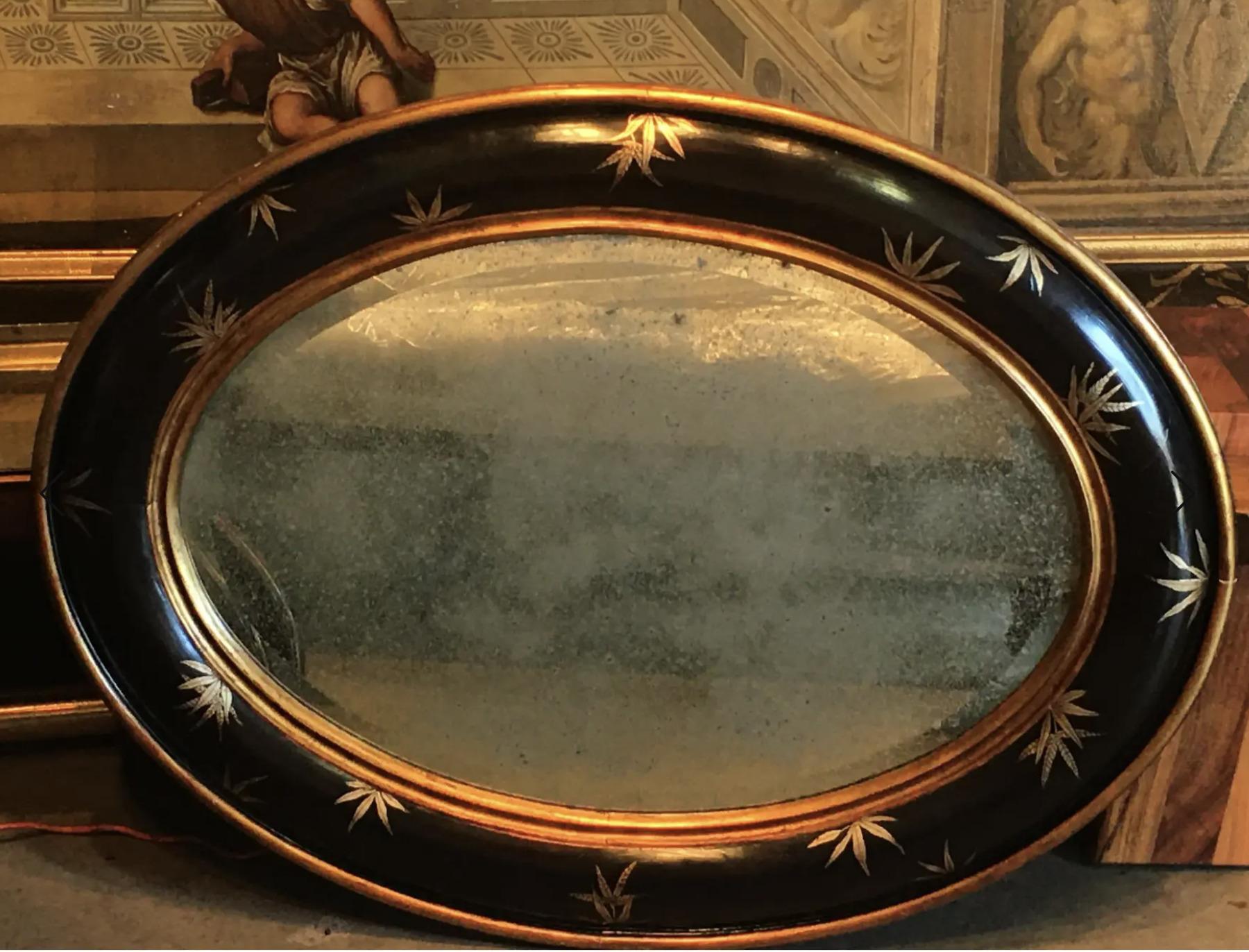 Hand-made, one-and-only bespoke Convex Oval frame done in traditional ebony black & faux gold chinoiserie. The leaves are period-style English Colonial bamboo. Gold rim is hand-worn to the red under-paint to give it an authentic aged appearance. The