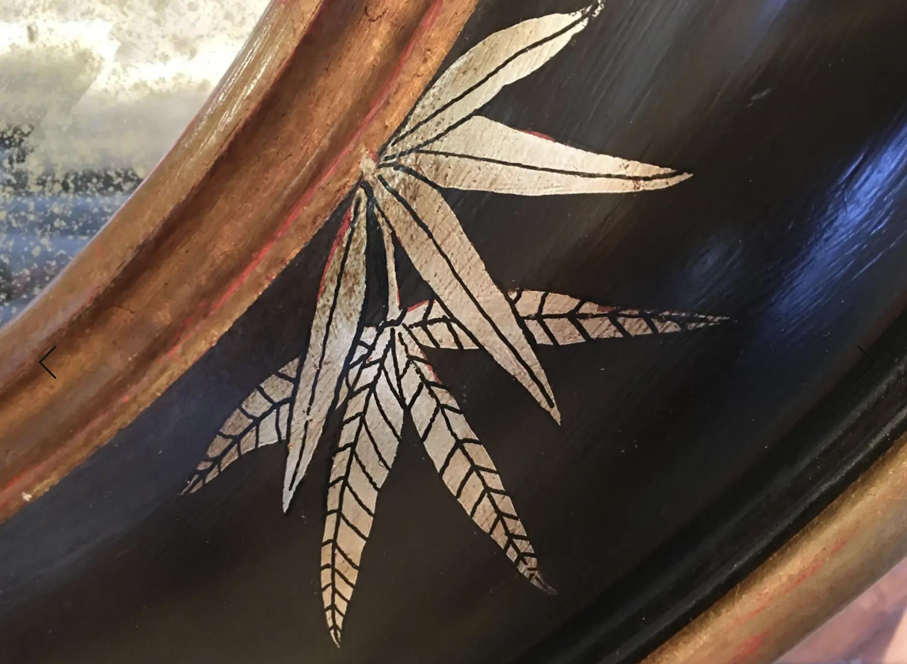 Chinoiserie Gold Bamboo Leaves on Black Frame With Antiqued Oval Smoky Mirror In Excellent Condition For Sale In Los Angeles, CA