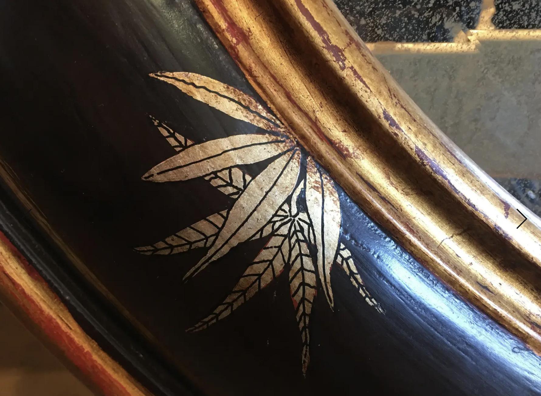 Contemporary Chinoiserie Gold Bamboo Leaves on Black Frame With Antiqued Oval Smoky Mirror For Sale